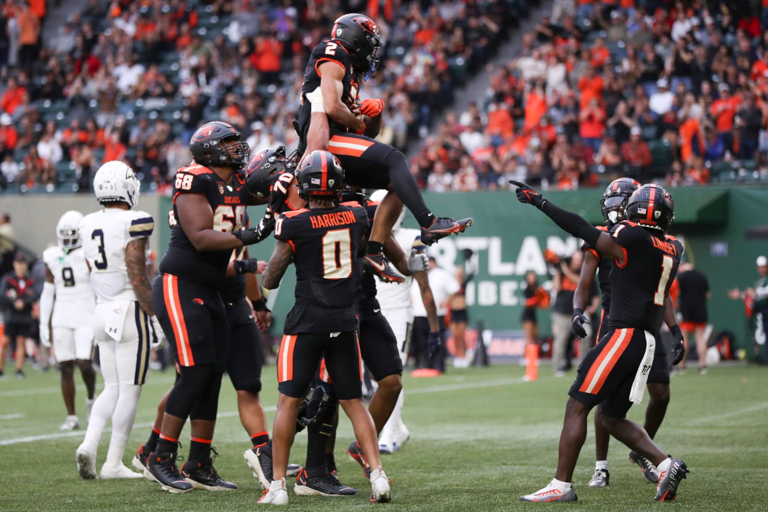 PORTLAND, OREGON - SEPTEMBER 17: Anthony Gould #2 of the Oregon State Beavers is lifted up by teammates after scoring a touchdown against the Montana State Bobcats during the first half at Providence Park on September 17, 2022 in Portland, Oregon. (Photo by Amanda Loman/Getty Images)