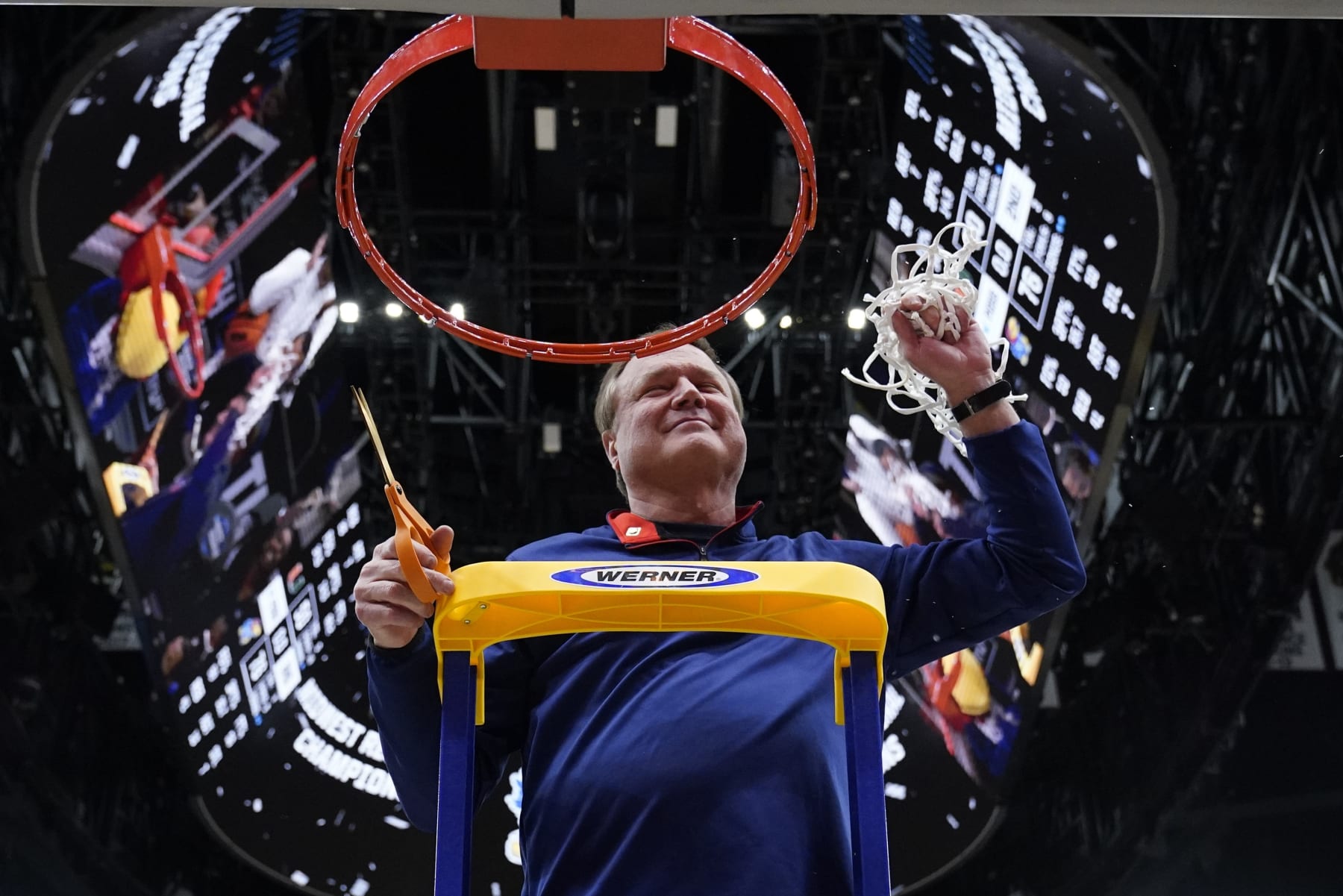 Kansas head coach Bill Self cuts down the net after a college basketball game in the Elite 8 round of the NCAA tournament Sunday, March 27, 2022, in Chicago. Kansas won 76-50 to advance to the Final Four. (AP Photo/Nam Y. Huh)