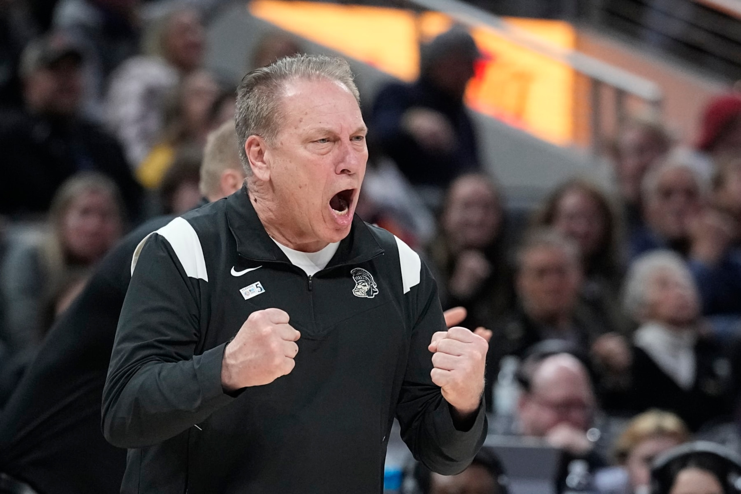 FILE - Michigan State coach Tom Izzo shouts during the second half of the team's NCAA college basketball game against Wisconsin at the Big Ten Conference men's tournament Friday, March 11, 2022, in Indianapolis. Michigan State has signed Izzo to a new deal valued at $6.2 million per season, giving him about $2 million more each year. The school announced the deal Thursday, Aug. 11, 2022, saying that the five-year rollover contract will need to be approved by its board next month. (AP Photo/Darron Cummings, File)