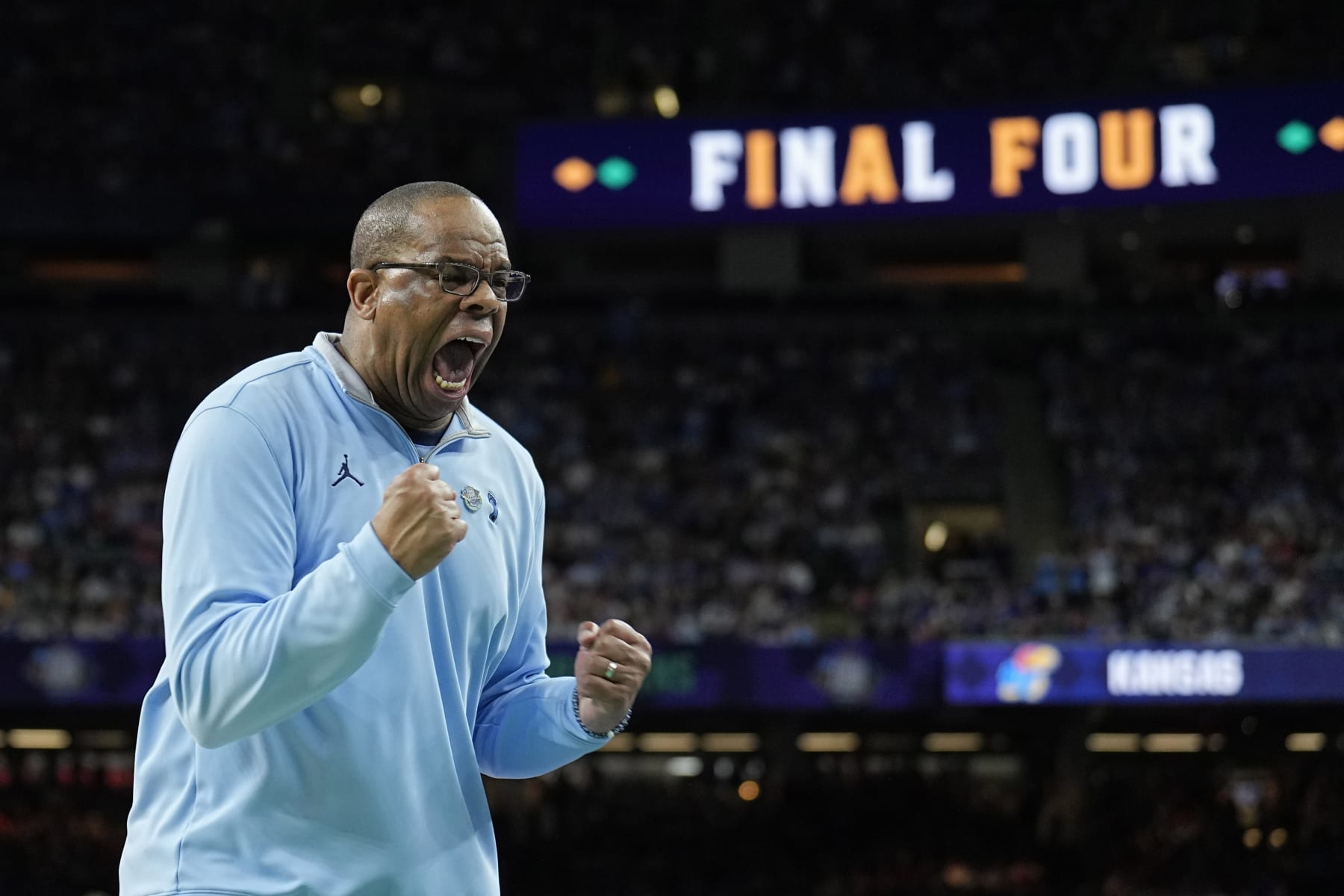 North Carolina head coach Hubert Davis reacts against Kansas during the first half of a college basketball game in the finals of the Men's Final Four NCAA tournament, Monday, April 4, 2022, in New Orleans. (AP Photo/Brynn Anderson)