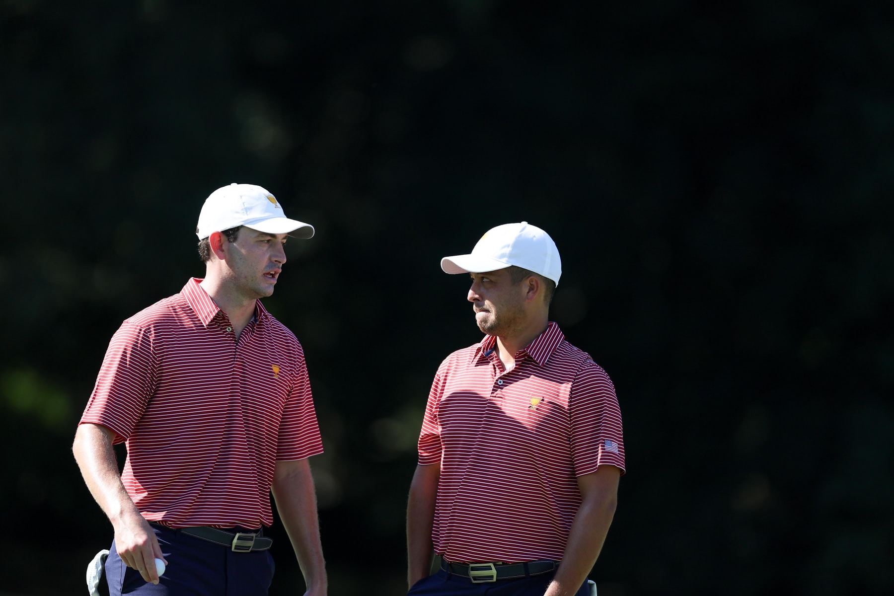 CHARLOTTE, NORTH CAROLINA - SEPTEMBER 20: Patrick Cantlay and Xander Schauffele of the United States Team talk during a practice round prior to the 2022 Presidents Cup at Quail Hollow Country Club on September 20, 2022 in Charlotte, North Carolina. (Photo by Rob Carr/Getty Images)