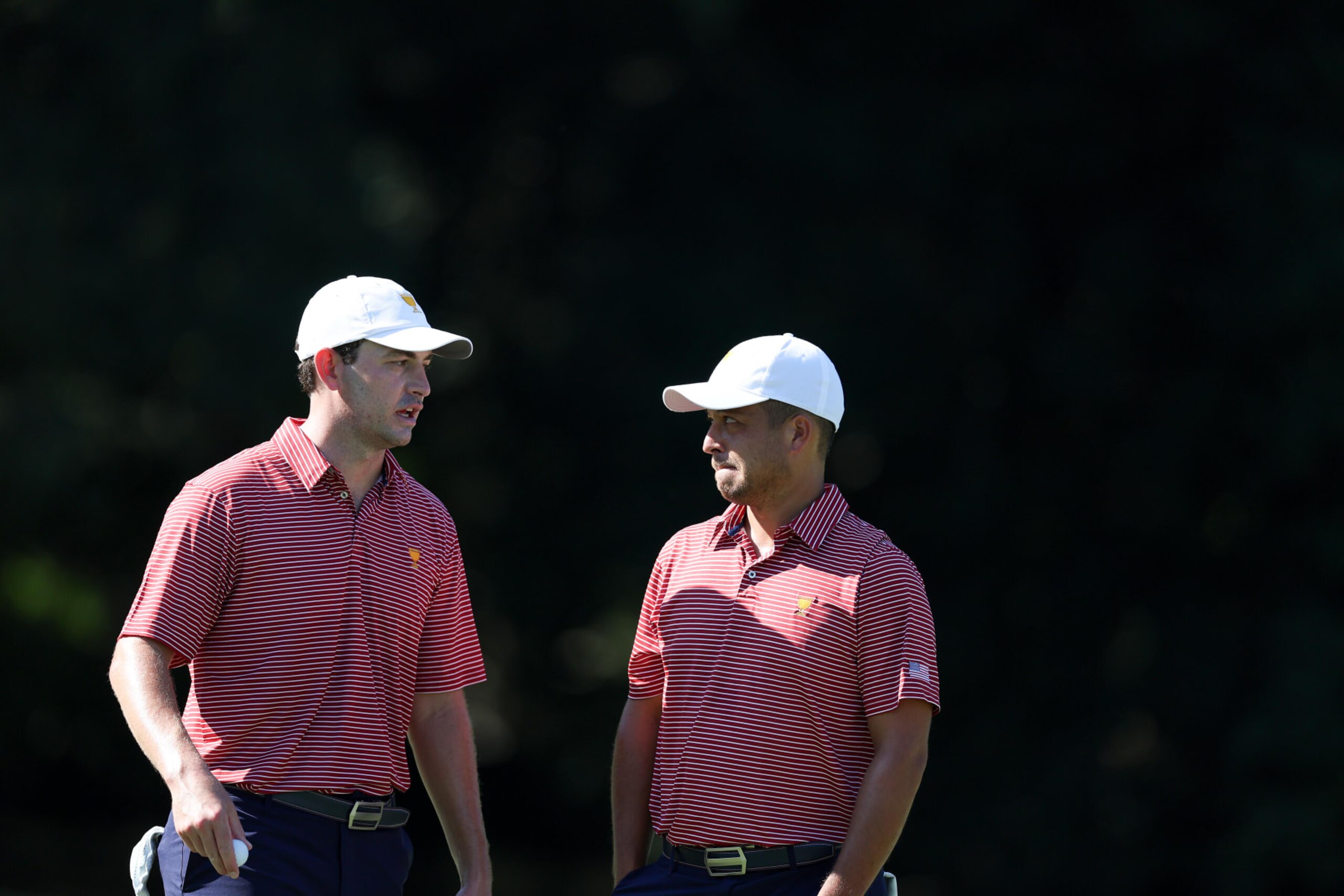 CHARLOTTE, NORTH CAROLINA - SEPTEMBER 20: Patrick Cantlay and Xander Schauffele of the United States Team talk during a practice round prior to the 2022 Presidents Cup at Quail Hollow Country Club on September 20, 2022 in Charlotte, North Carolina. (Photo by Rob Carr/Getty Images) CHARLOTTE, NORTH CAROLINA - SEPTEMBER 20: Patrick Cantlay and Xander Schauffele of the United States Team talk during a practice round prior to the 2022 Presidents Cup at Quail Hollow Country Club on September 20, 2022 in Charlotte, North Carolina. (Photo by Rob Carr/Getty Images)
