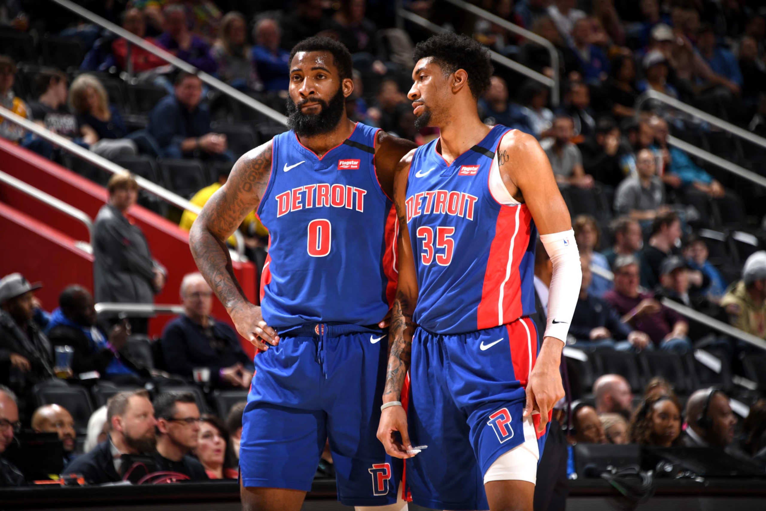 DETROIT, MI - JANUARY 11: Andre Drummond #0 of the Detroit Pistons and Christian Wood #35 of the Detroit Pistons look on during a game against the Chicago Bulls on January 11, 2019 at Little Caesars Arena in Detroit, Michigan. NOTE TO USER: User expressly acknowledges and agrees that, by downloading and/or using this photograph, User is consenting to the terms and conditions of the Getty Images License Agreement. Mandatory Copyright Notice: Copyright 2019 NBAE (Photo by Chris Schwegler/NBAE via Getty Images)