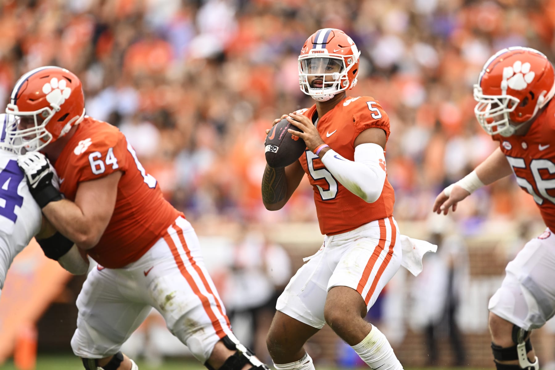 CLEMSON, SOUTH CAROLINA - SEPTEMBER 10: DJ Uiagalelei #5 of the Clemson Tigers looks for a pass against the Furman Paladins during the first quarter at Memorial Stadium on September 10, 2022 in Clemson, South Carolina. (Photo by Eakin Howard/Getty Images)