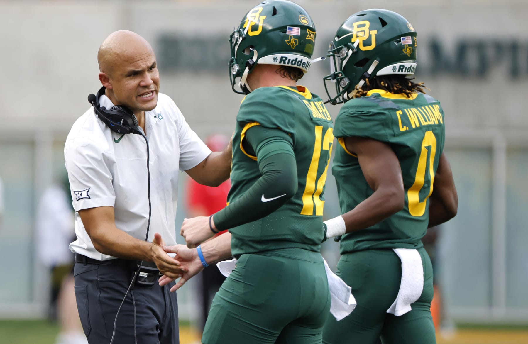 WACO, TX -SEPTEMBER 3: Head coach Dave Aranda of the Baylor Bears welcomes his players to the sidelines after a Baylor touchdown against the Albany Great Danes in the first half at McLane Stadium on September 3, 2022 in Waco, Texas. (Photo by Ron Jenkins/Getty Images)