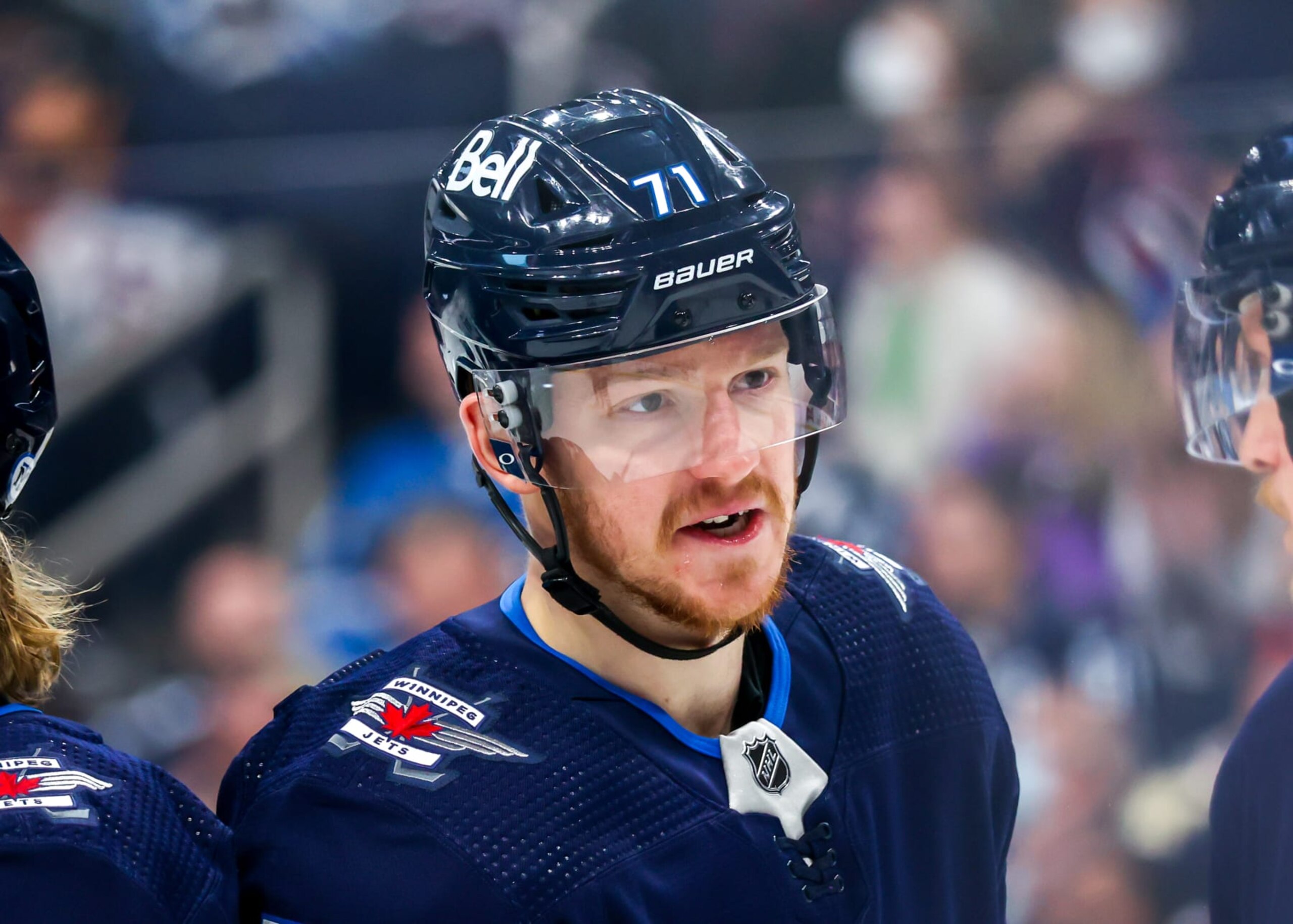 WINNIPEG, MB - MAY 01: Evgeny Svechnikov #71 of the Winnipeg Jets discusses strategy with a teammate during a first period stoppage of play against the Seattle Kraken at Canada Life Centre on May 01, 2022 in Winnipeg, Manitoba, Canada. (Photo by Jonathan Kozub/NHLI via Getty Images)