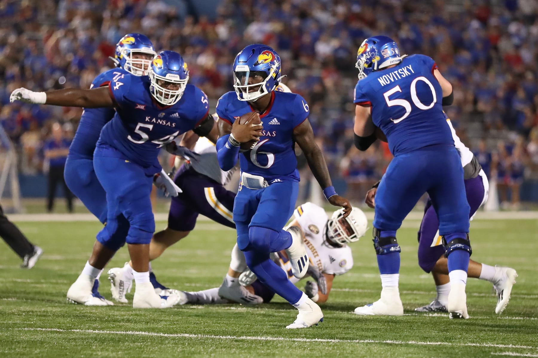 LAWRENCE, KS - SEPTEMBER 02: Kansas Jayhawks quarterback Jalon Daniels (6) during an 11-yard touchdown run in the second quarter of a college football game between the Tennessee Tech Golden Eagles and Kansas Jayhawks on September 2, 2022 at Memorial Stadium in Lawrence, KS.  Photo by Scott Winters/Icon Sportswire via Getty Images)