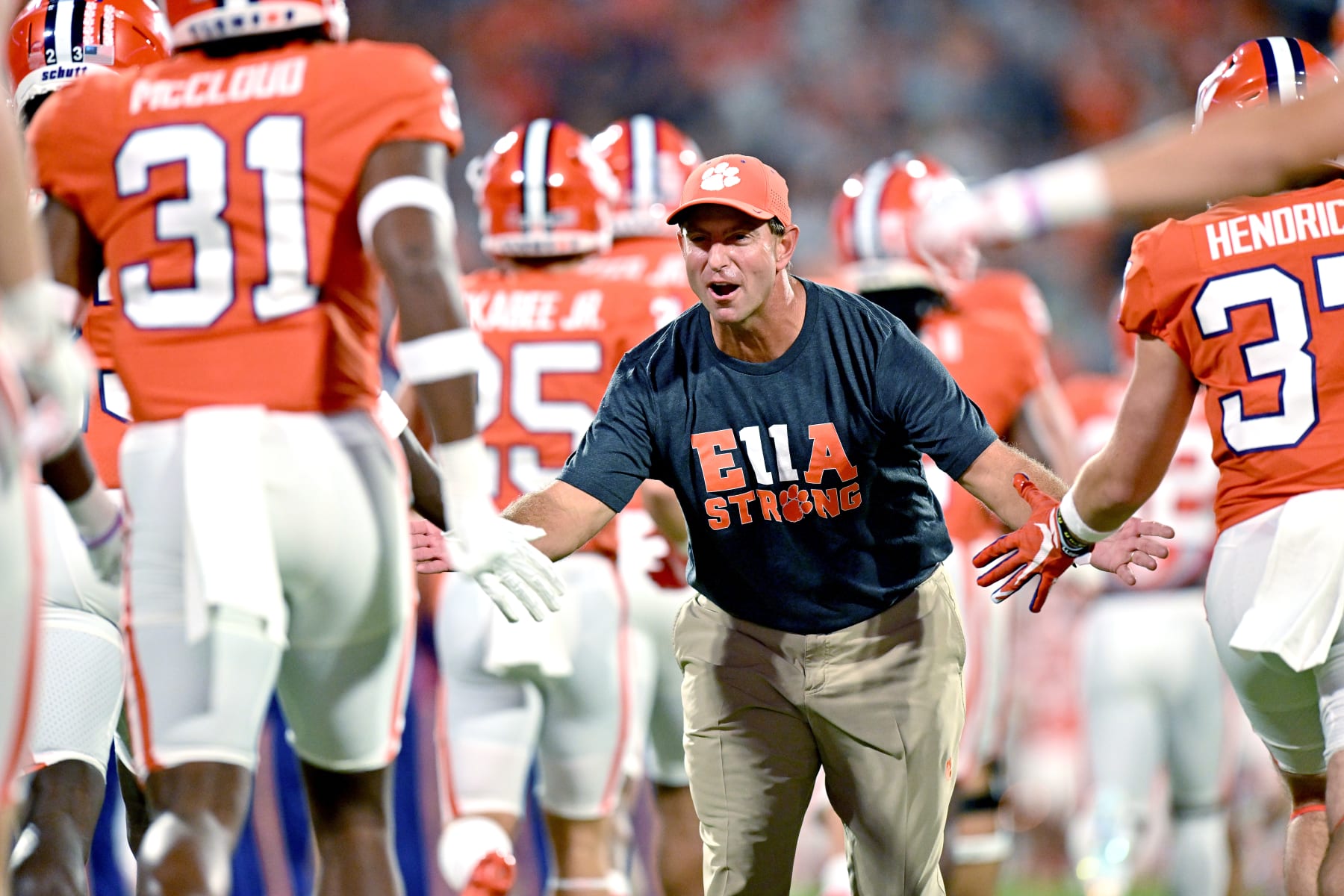 CLEMSON, SOUTH CAROLINA - SEPTEMBER 17:  Head coach Dabo Swinney of the Clemson Tigers greets his plaers aas they take the field before their game against the Louisiana Tech Bulldogs at Memorial Stadium on September 17, 2022 in Clemson, South Carolina. (Photo by Grant Halverson/Getty Images)