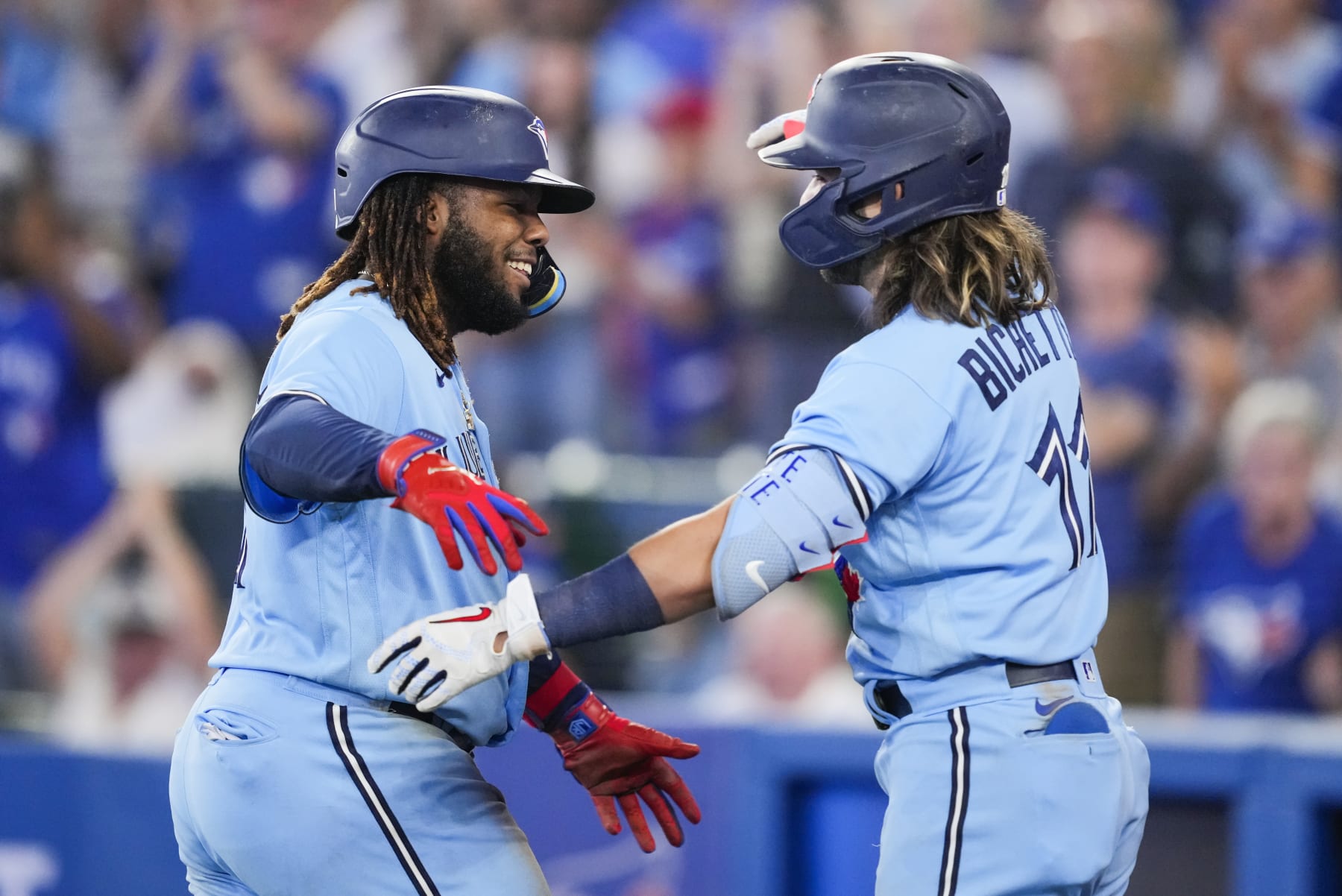 TORONTO, ON - SEPTEMBER 18: Vladimir Guerrero Jr. #27 celebrates his home run with Bo Bichette #11 of the Toronto Blue Jays in the seventh inning during their MLB game at the Rogers Centre on September 18, 2022 in Toronto, Ontario, Canada. (Photo by Mark Blinch/Getty Images)
