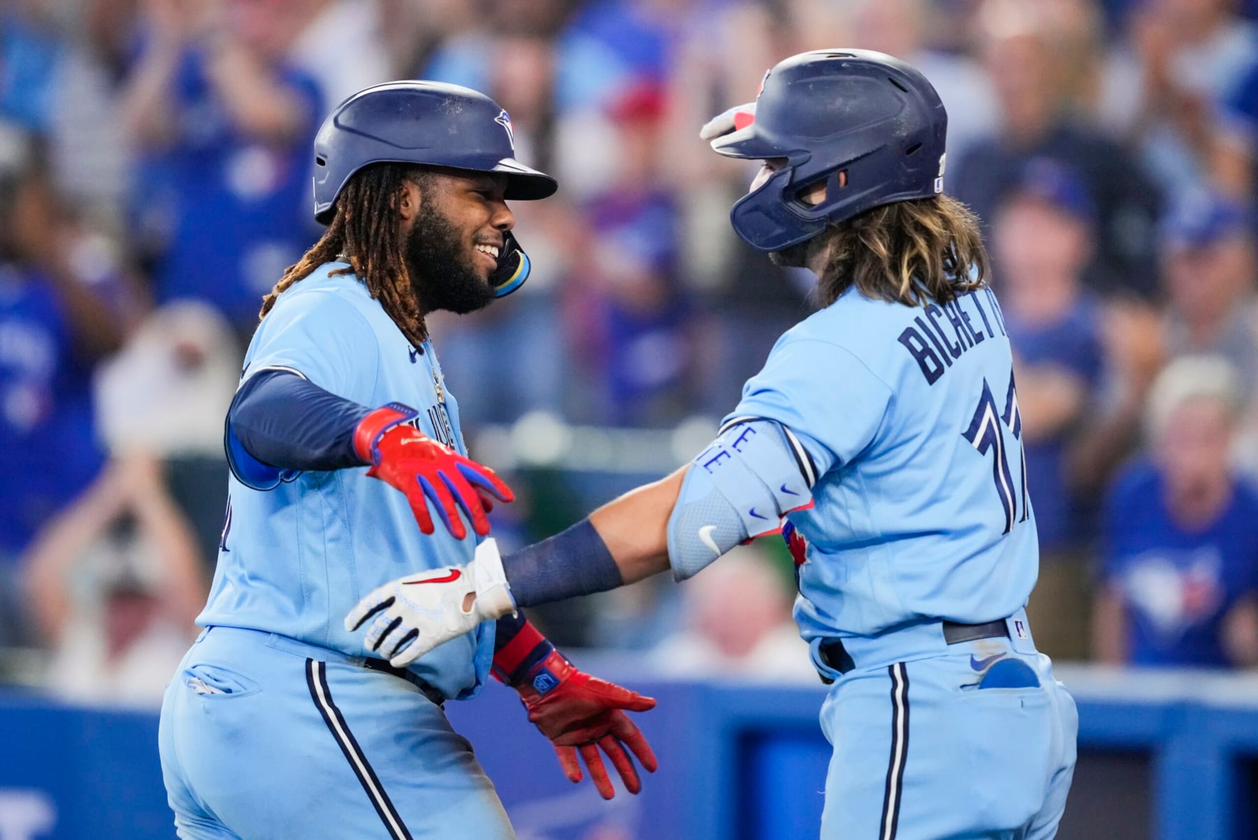 TORONTO, ON - SEPTEMBER 18: Vladimir Guerrero Jr. #27 celebrates his home run with Bo Bichette #11 of the Toronto Blue Jays in the seventh inning during their MLB game at the Rogers Centre on September 18, 2022 in Toronto, Ontario, Canada. (Photo by Mark Blinch/Getty Images)