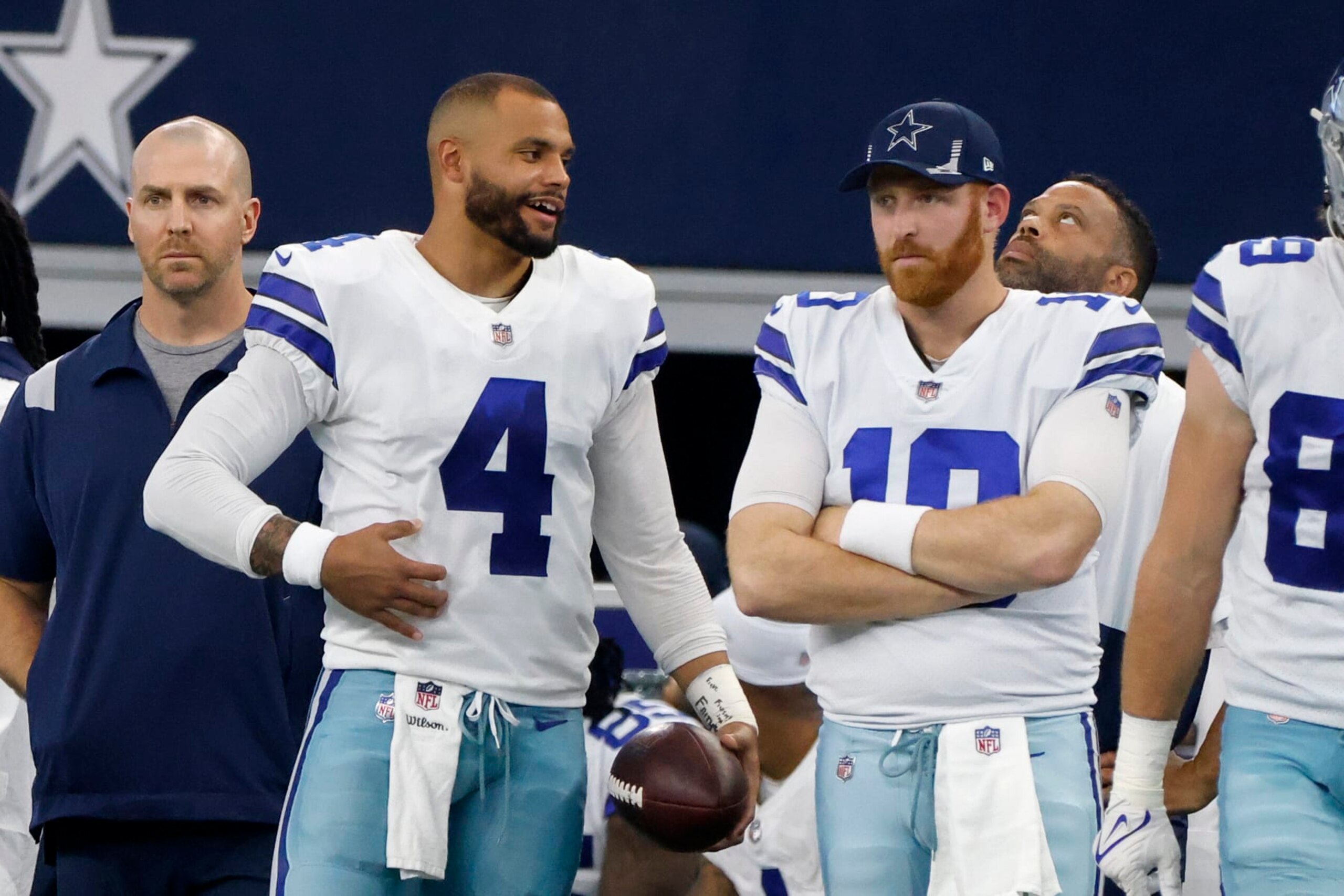 Dallas Cowboys quarterback Dak Prescott (4) talks to quarterback Cooper Rush (10) on the sideline during an NFL football game against the New York Giants in Arlington, Texas, Sunday, Oct. 10, 2021. (AP Photo/Michael Ainsworth)