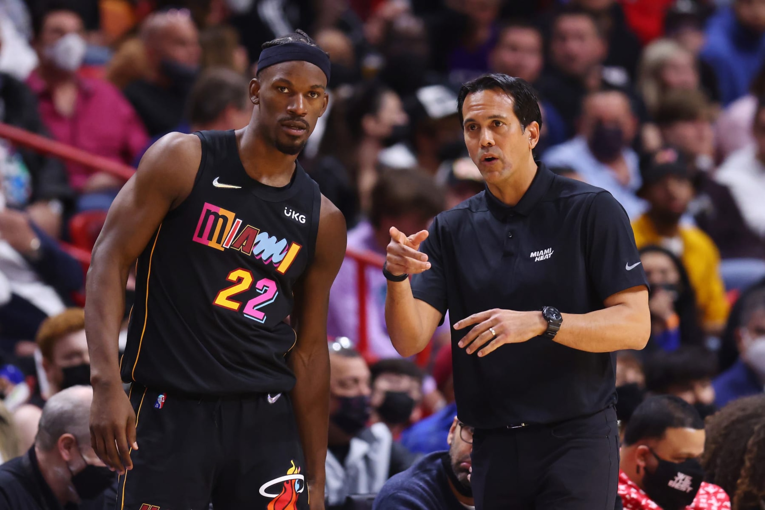 MIAMI, FLORIDA - JANUARY 23: Jimmy Butler #22 of the Miami Heat talks with head coach Erik Spoelstra against the Los Angeles Lakers during the first half at FTX Arena on January 23, 2022 in Miami, Florida. NOTE TO USER: User expressly acknowledges and agrees that, by downloading and or using this photograph, User is consenting to the terms and conditions of the Getty Images License Agreement.  (Photo by Michael Reaves/Getty Images)