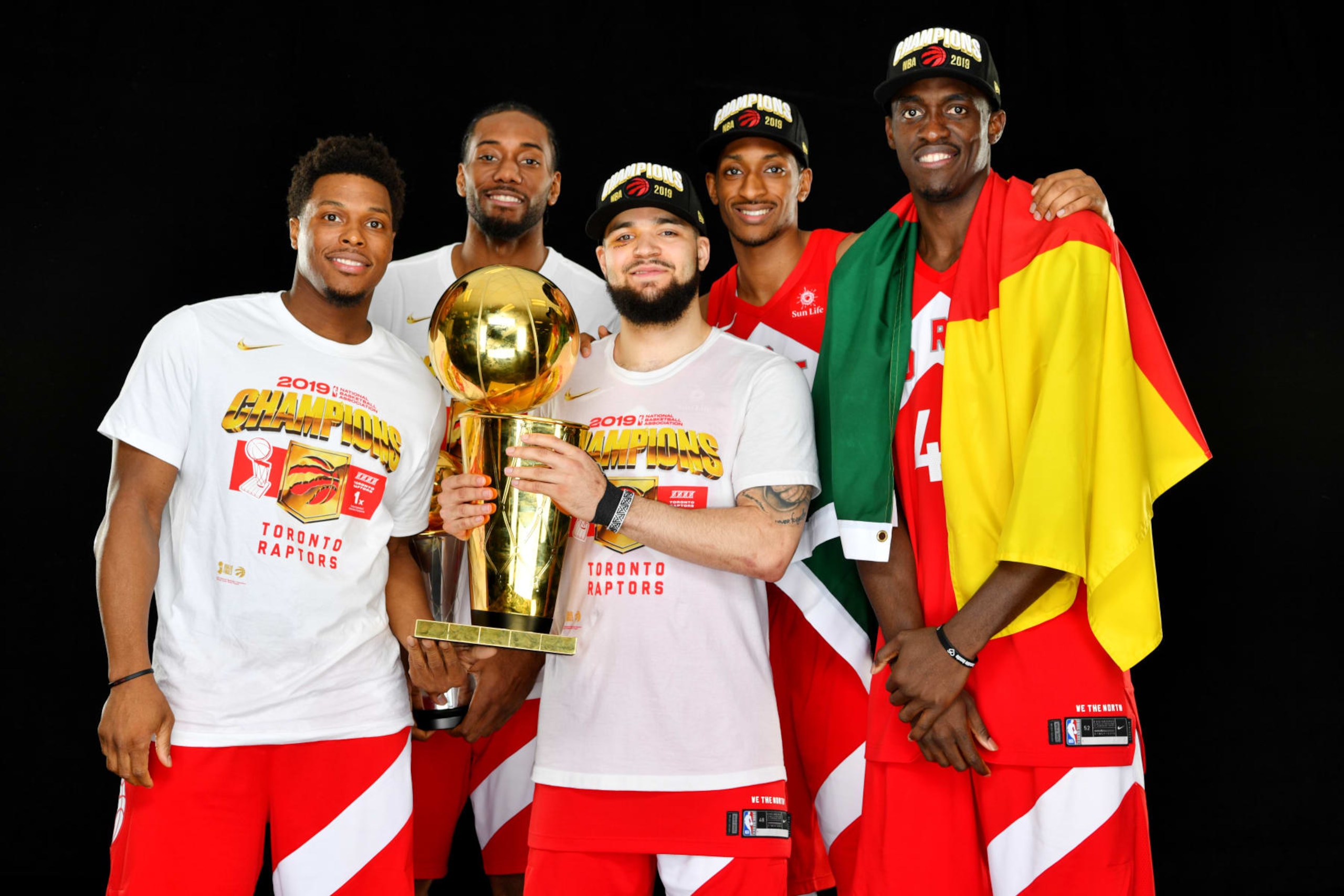 OAKLAND, CA - JUNE 13: Kyle Lowry #7 Kawhi Leonard #2 Fred VanVleet #23 Malcolm Miller #13 and Pascal Siakam #43 of the Toronto Raptors pose for a portrait with the Larry O'Brien Trophy after winning Game Six of the 2019 NBA Finals against the Golden State Warriors on June 13, 2019 at ORACLE Arena in Oakland, California. NOTE TO USER: User expressly acknowledges and agrees that, by downloading and/or using this photograph, user is consenting to the terms and conditions of Getty Images License Agreement. Mandatory Copyright Notice: Copyright 2019 NBAE (Photo by Jesse D. Garrabrant/NBAE via Getty Images)