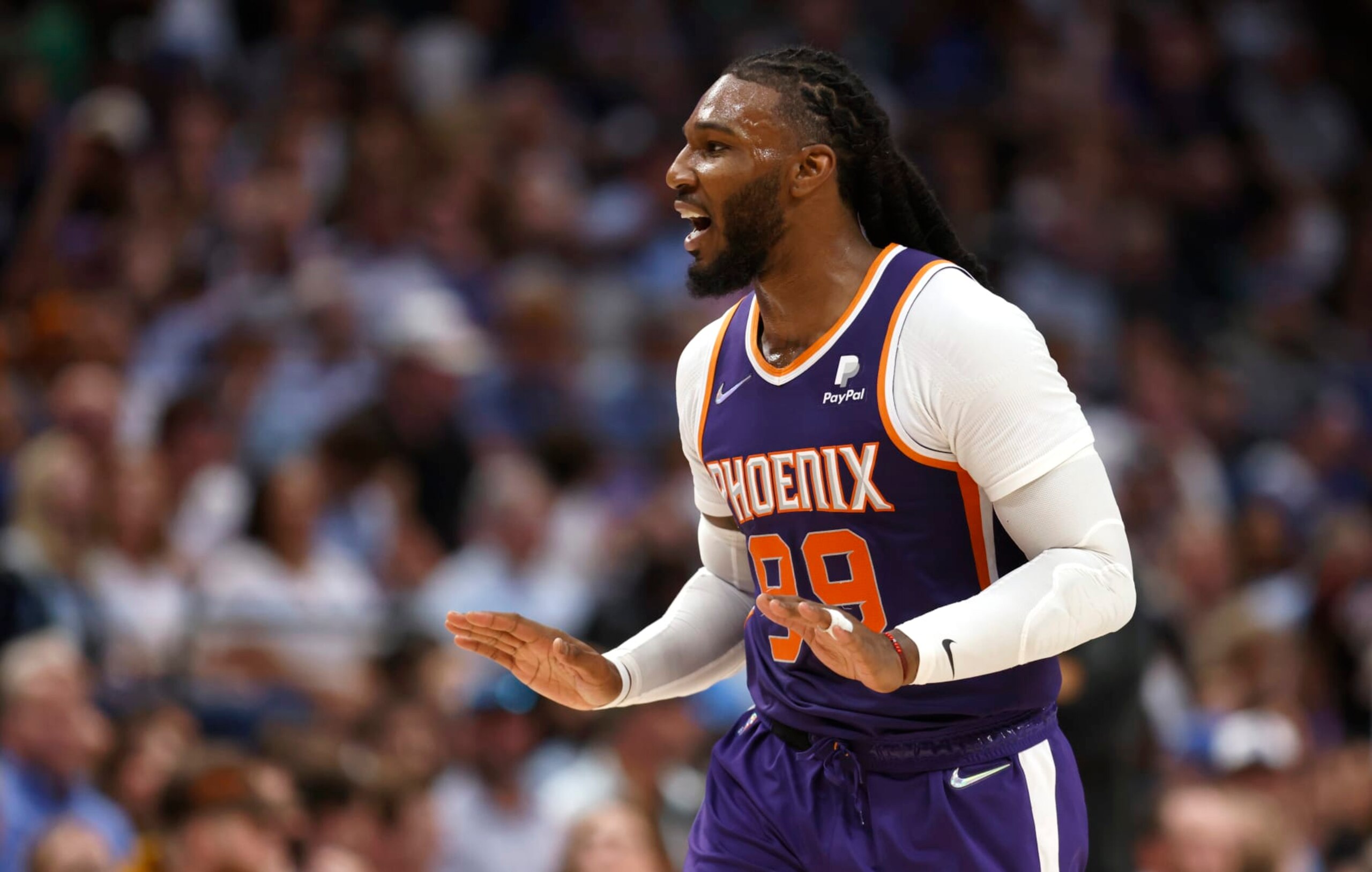DALLAS, TX - MAY 6: Jae Crowder #99 of the Phoenix Suns reacts toward the Mavericks bench after scoring with a three point shot during the second half of Game Three of the 2022 NBA Playoffs Western Conference Semifinals at American Airlines Center on May 6, 2022 in Dallas, Texas. NOTE TO USER: User expressly acknowledges and agrees that, by downloading and or using this photograph, User is consenting to the terms and conditions of the Getty Images License Agreement. (Photo by Ron Jenkins/Getty Images)