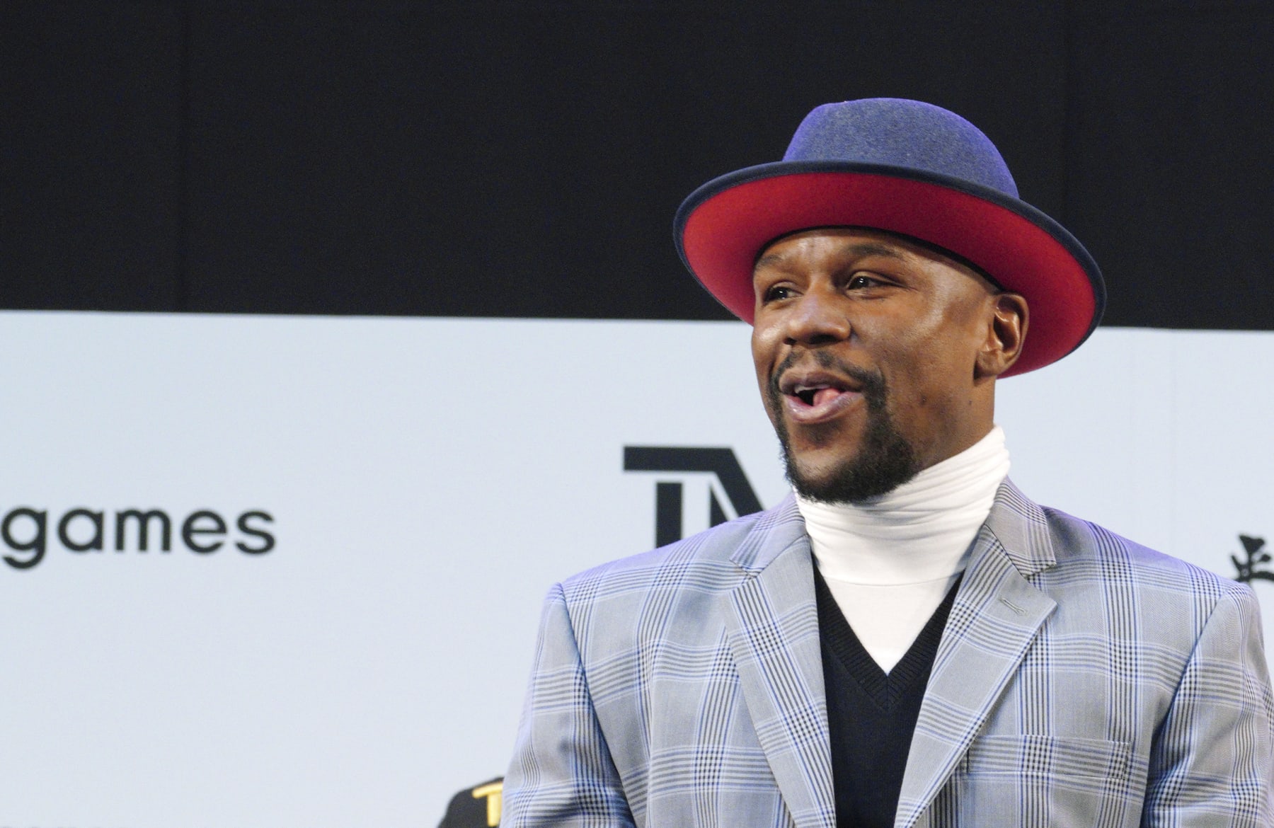 Floyd Mayweather Jr. smiles at the stage as he meets Japanese kickboxer Tenshin Nasukawa, during a ceremony at Saitama Super Arena in Saitama, north of Tokyo Sunday, Dec. 30, 2018. Mayweather is scheduled to fight in a three-round exhibition match in Japan on New Year's Eve. (AP Photo/Eugene Hoshiko)