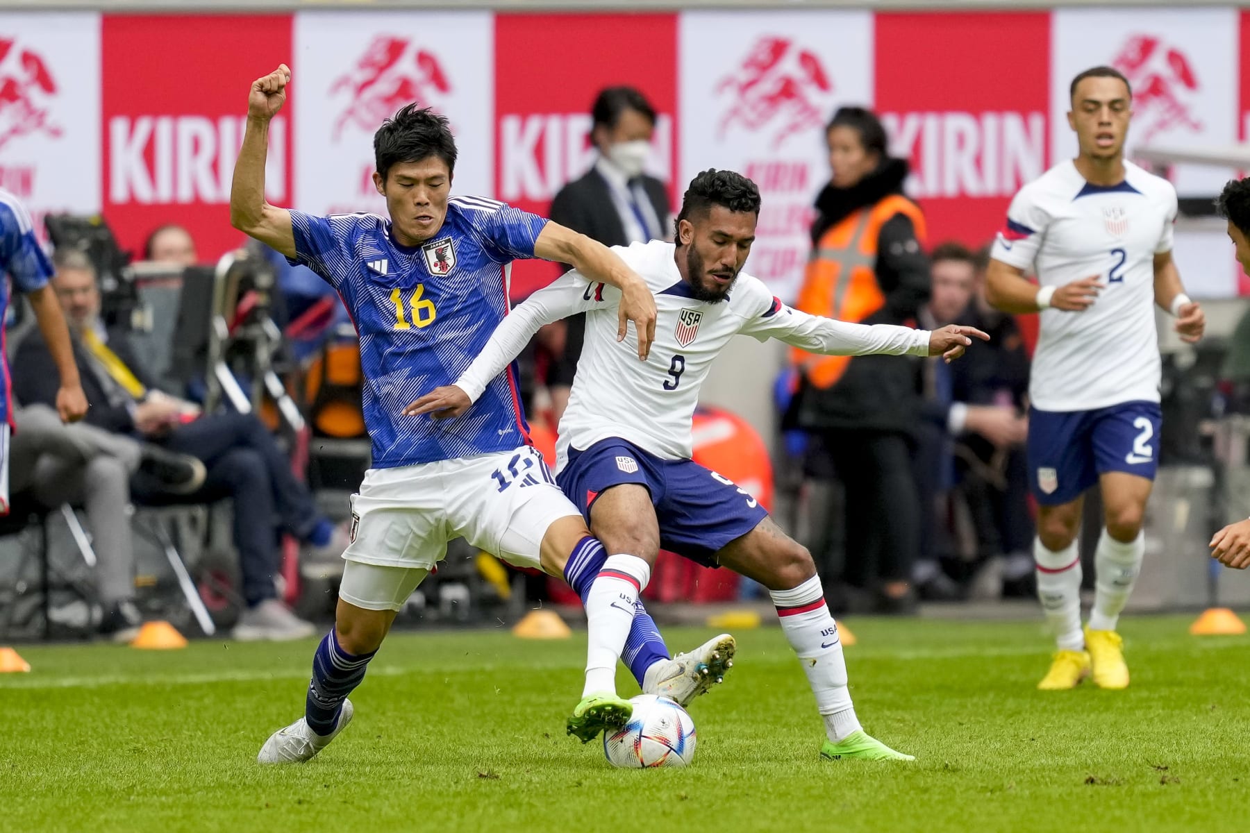 DUESSELDORF, GERMANY - SEPTEMBER 23: Takehiro Tomiyasu of Japan and Jesus Ferrerra of USA battle for the ball during the international friendly match between Japan and United States at Merkur Spiel-Arena on September 23, 2022 in Duesseldorf, Germany. (Photo by Alex Gottschalk/DeFodi Images via Getty Images)