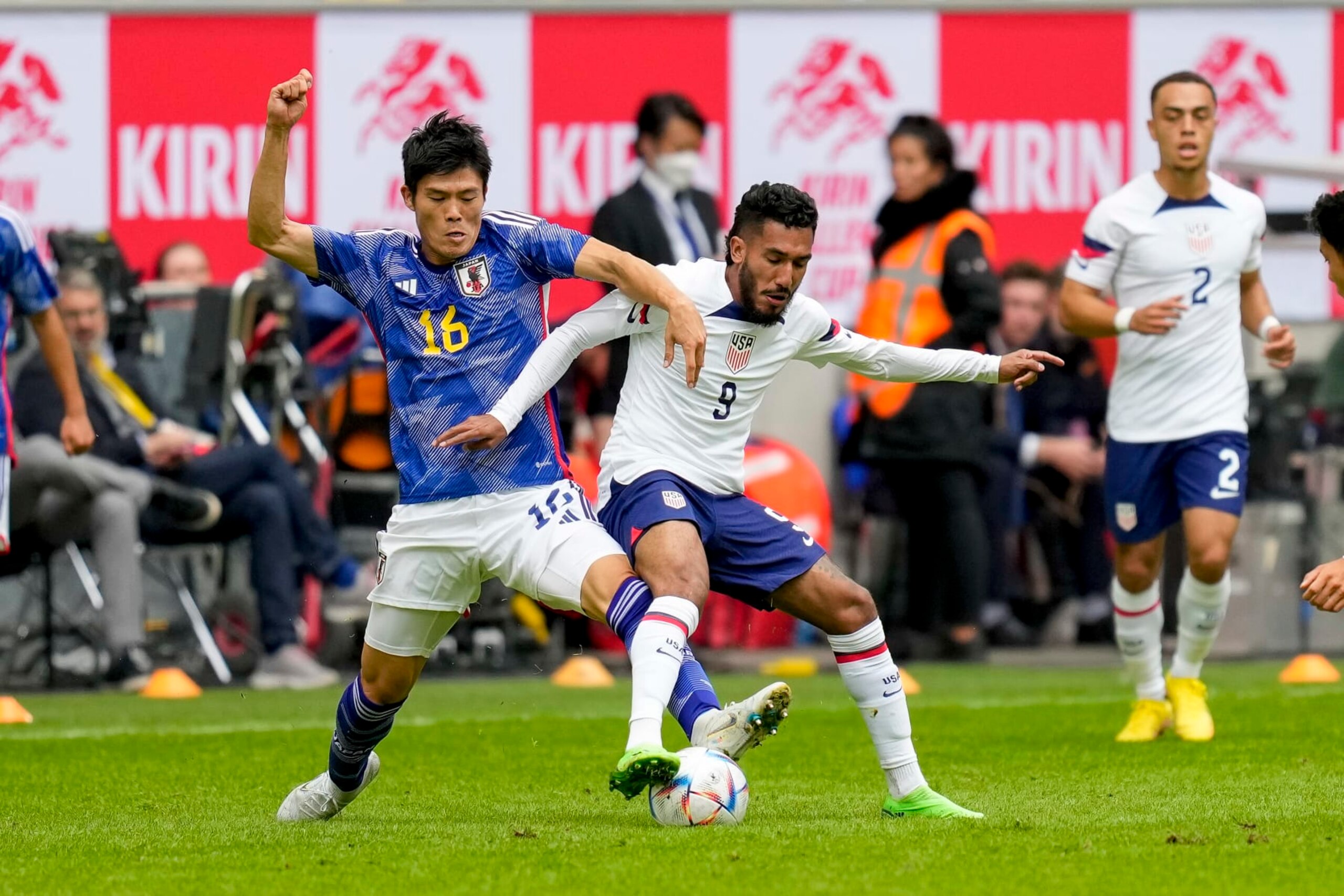 DUESSELDORF, GERMANY - SEPTEMBER 23: Takehiro Tomiyasu of Japan and Jesus Ferrerra of USA battle for the ball during the international friendly match between Japan and United States at Merkur Spiel-Arena on September 23, 2022 in Duesseldorf, Germany. (Photo by Alex Gottschalk/DeFodi Images via Getty Images)