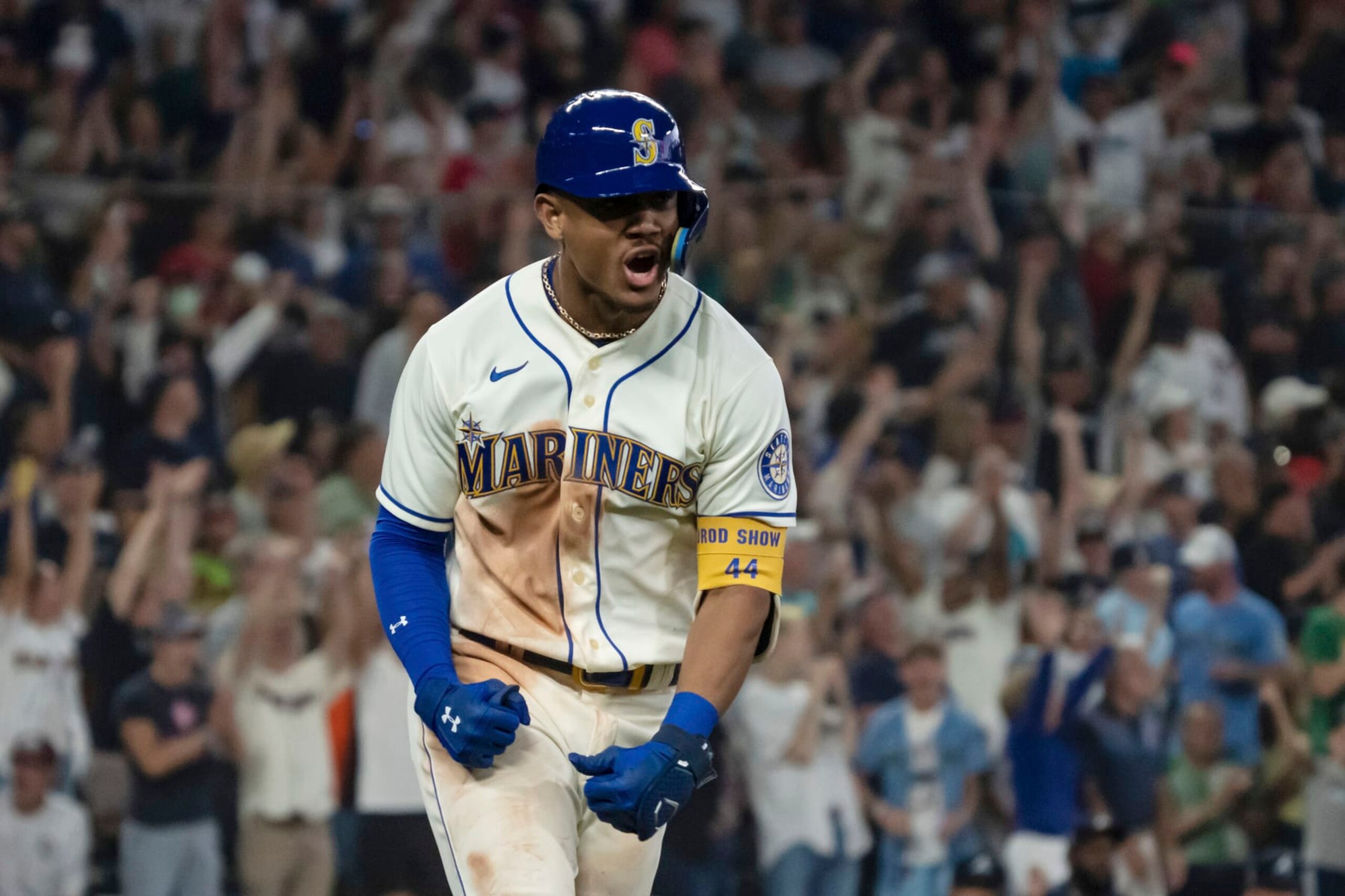 Seattle Mariners' Julio Rodriguez celebrates while rounding the bases after hitting a solo home run off Atlanta Braves relief pitcher Kenley Jansen during the ninth inning of a baseball game, Sunday, Sept. 11, 2022, in Seattle. The Mariners won 8-7. (AP Photo/Stephen Brashear) Seattle Mariners' Julio Rodriguez celebrates while rounding the bases after hitting a solo home run off Atlanta Braves relief pitcher Kenley Jansen during the ninth inning of a baseball game, Sunday, Sept. 11, 2022, in Seattle. The Mariners won 8-7. (AP Photo/Stephen Brashear)