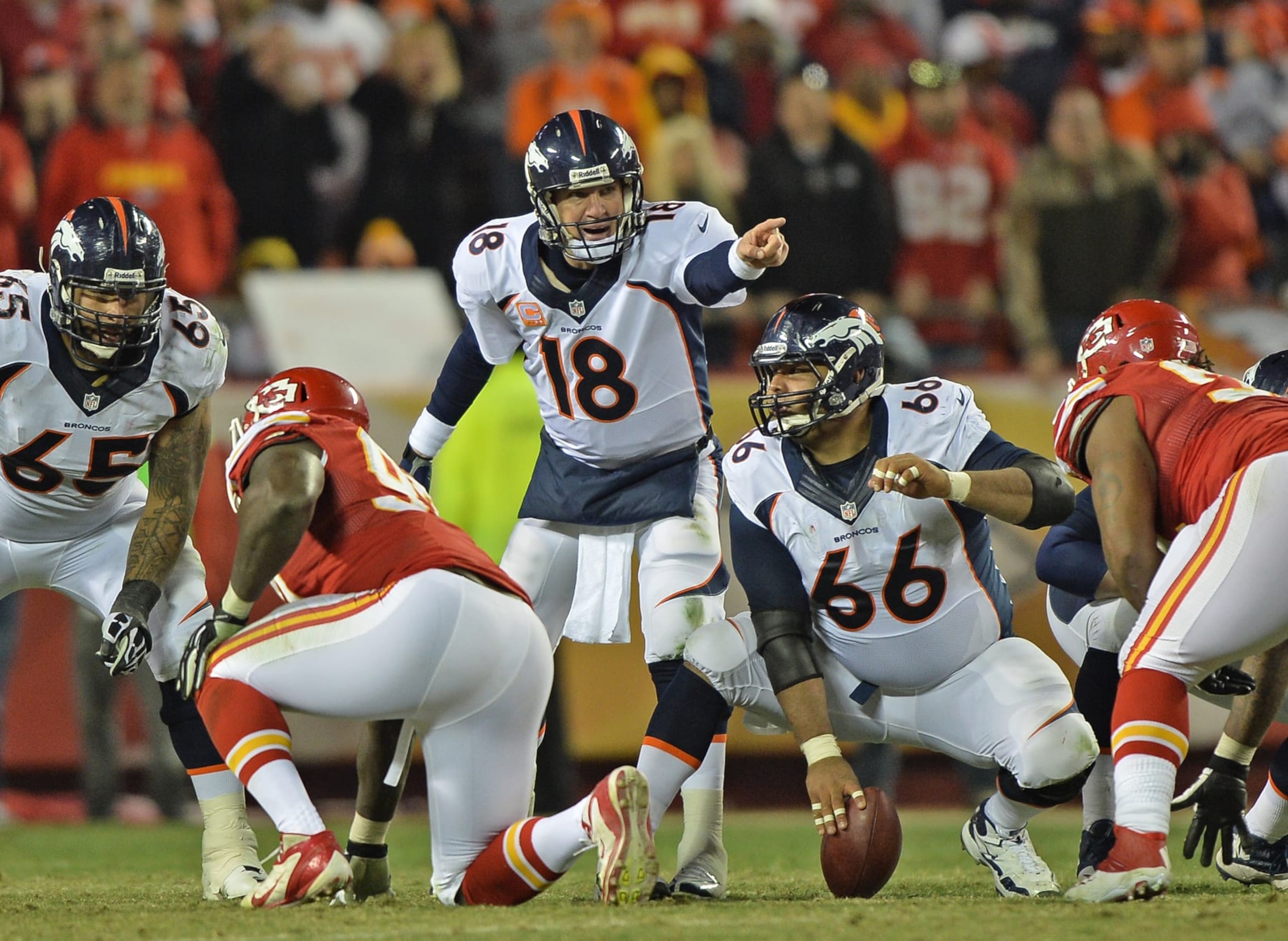 KANSAS CITY, MO - DECEMBER 01:  Quarterback Peyton Manning #18 of the Denver Broncos calls out some instructions to center Manny Ramirez #66 against the Kansas City Chiefs during the second half on December 1, 2013 at Arrowhead Stadium in Kansas City, Missouri.  Denver beat Kansas City 35-28.  (Photo by Peter Aiken/Getty Images)
