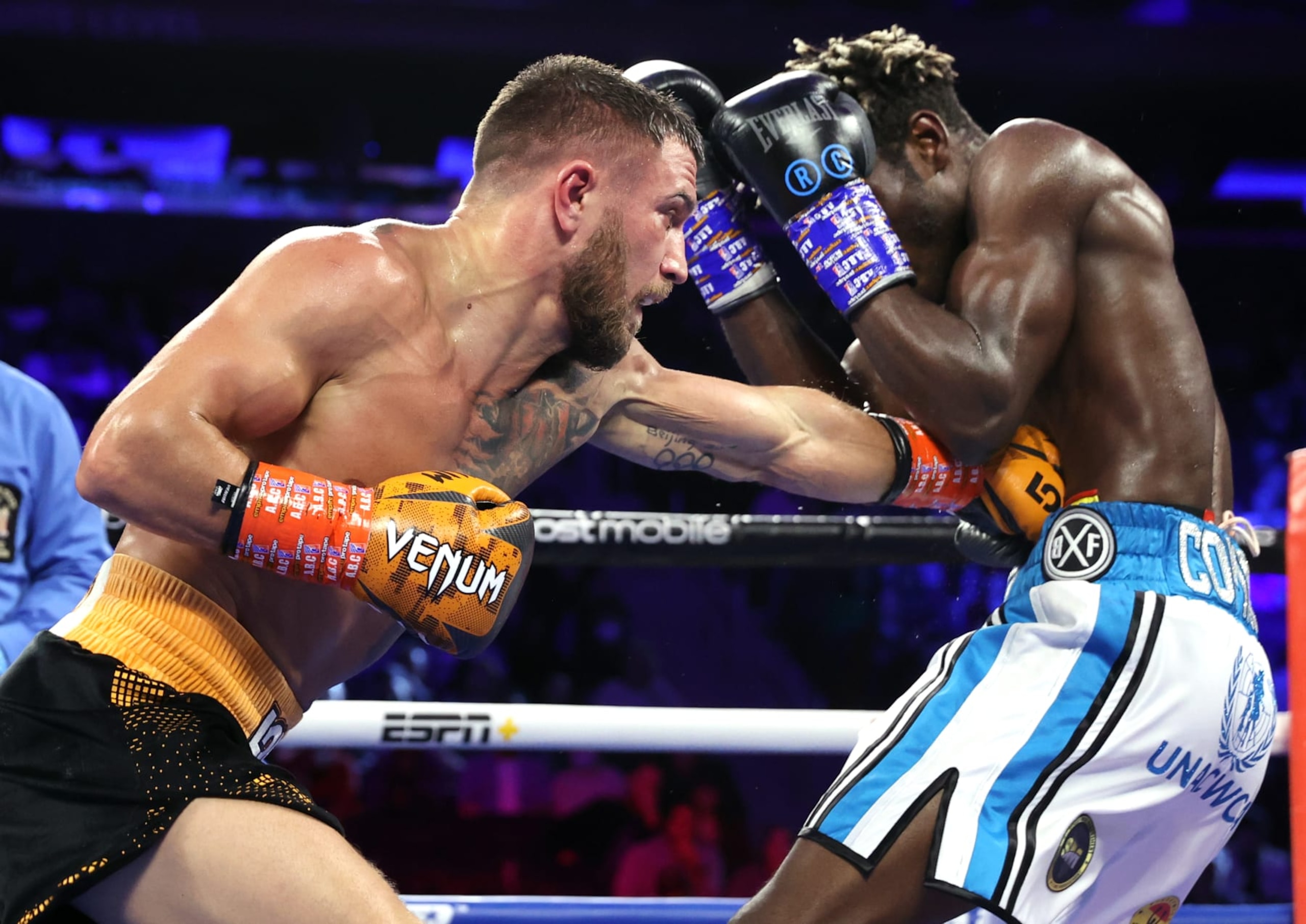 NEW YORK, NEW YORK - DECEMBER 11: Vasiliy Lomachenko (L) and Richard Commey (R) exchange punches during their fight for the WBO intercontinental lightweight championship at Madison Square Garden on December 11, 2021 in New York City. (Photo by Mikey Williams/Top Rank Inc via Getty Images)