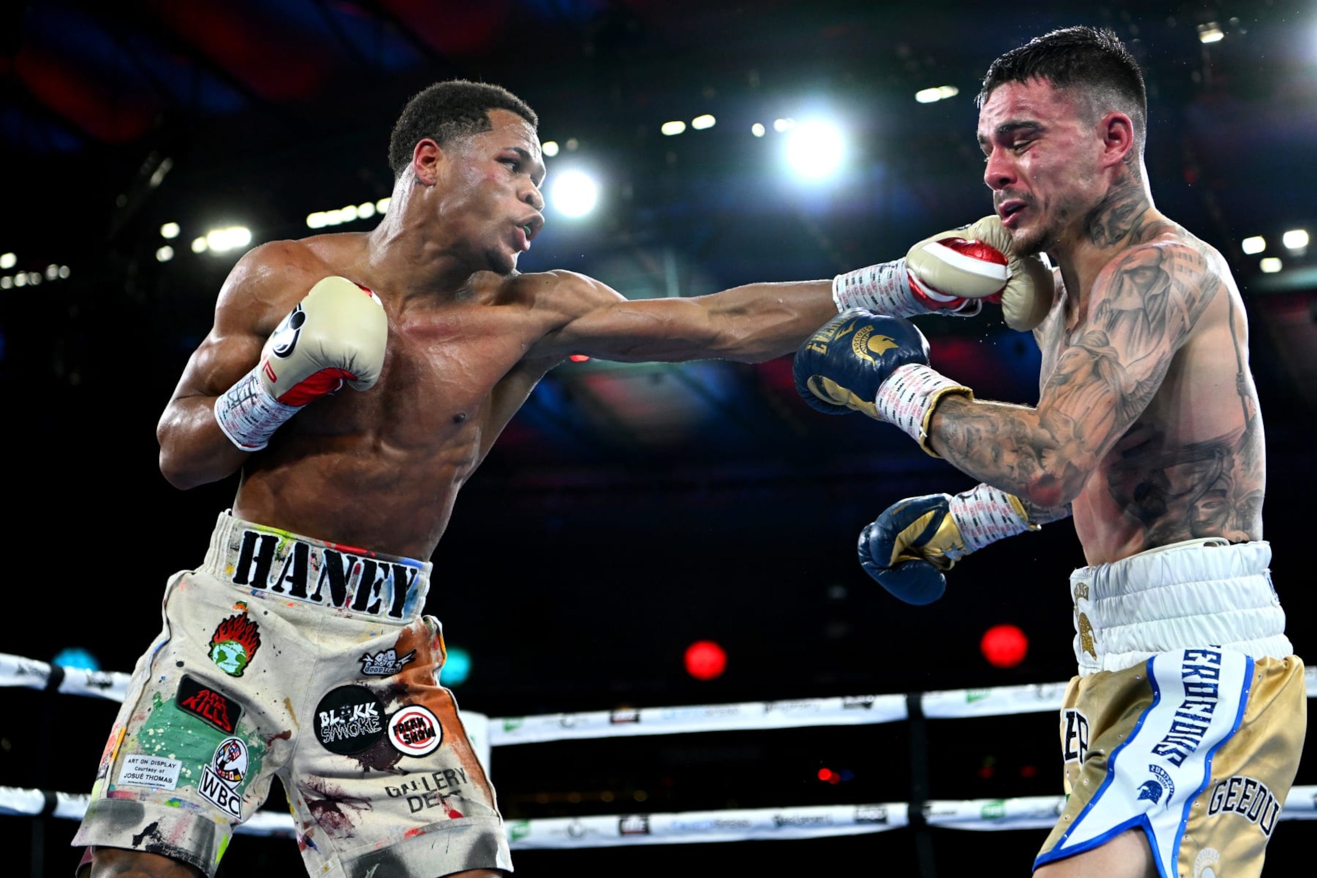 MELBOURNE, AUSTRALIA - JUNE 05: Devin Haney of the United States lands a punch to George Kambosos Jr of Australia during the World Lightweight Championship bout between George Kambosos Jr. of Australia and Devin Haney of the United States at Marvel Stadium on June 05, 2022 in Melbourne, Australia. (Photo by Quinn Rooney/Getty Images)