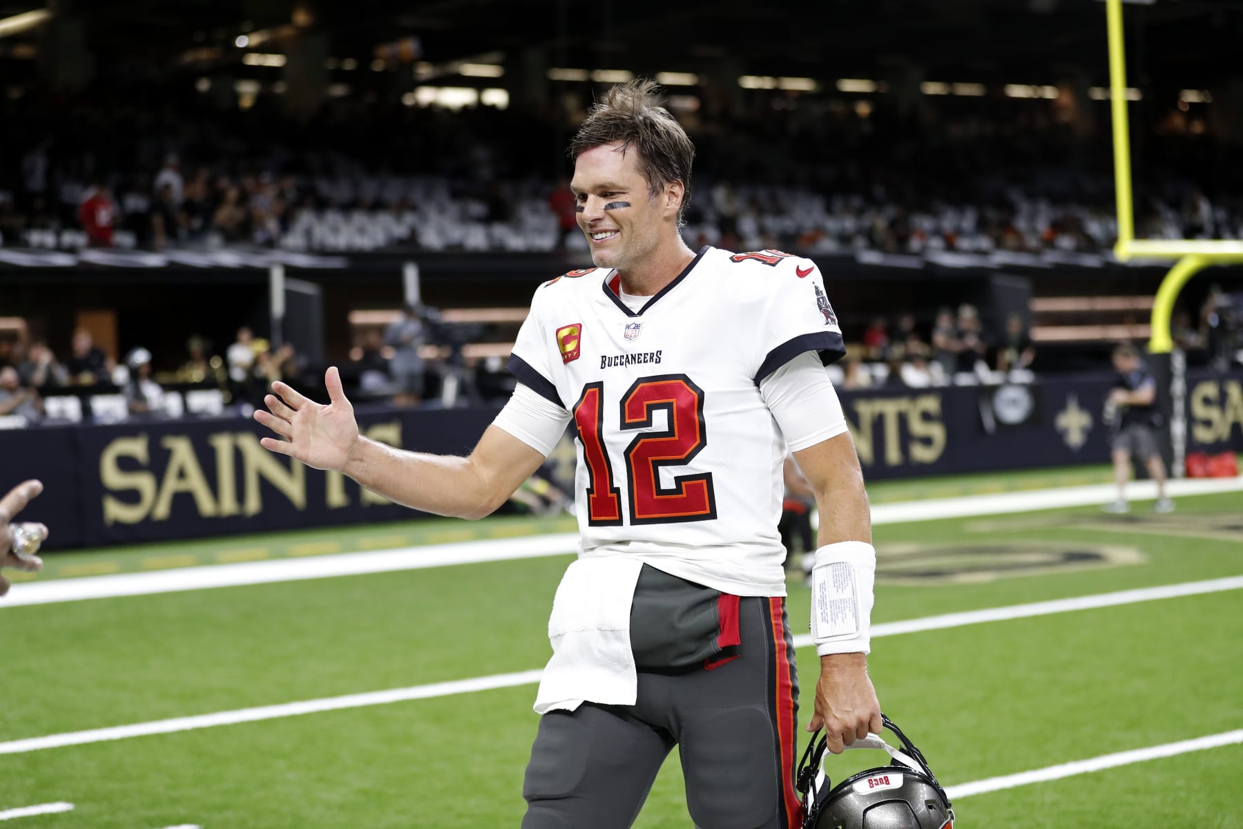 Tampa Bay Buccaneers quarterback Tom Brady (12) warms up before an NFL football game against the New Orleans Saints, Sunday, Sept. 18, 2022, in New Orleans. (AP Photo/Tyler Kaufman)
