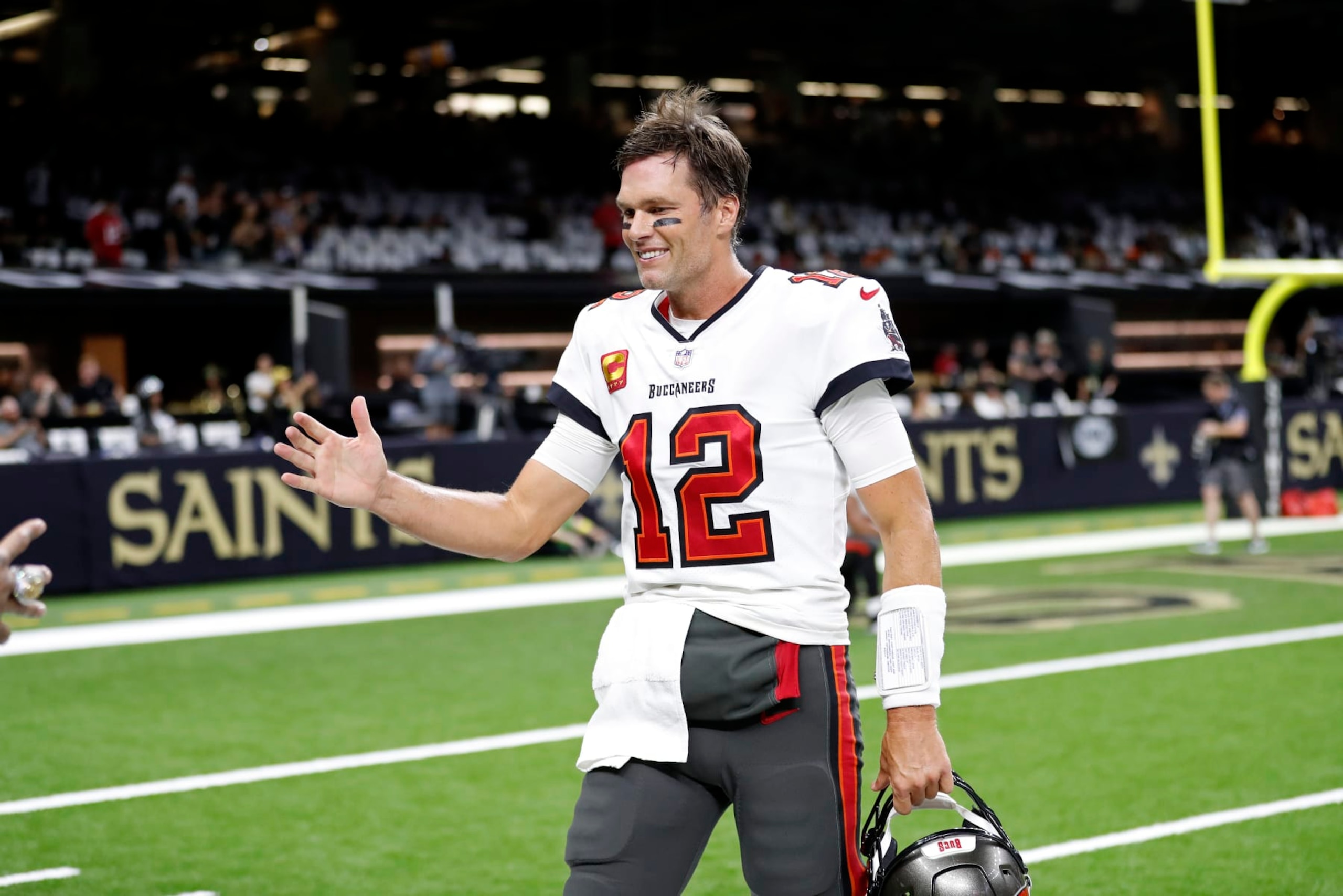 Tampa Bay Buccaneers quarterback Tom Brady (12) warms up before an NFL football game against the New Orleans Saints, Sunday, Sept. 18, 2022, in New Orleans. (AP Photo/Tyler Kaufman)