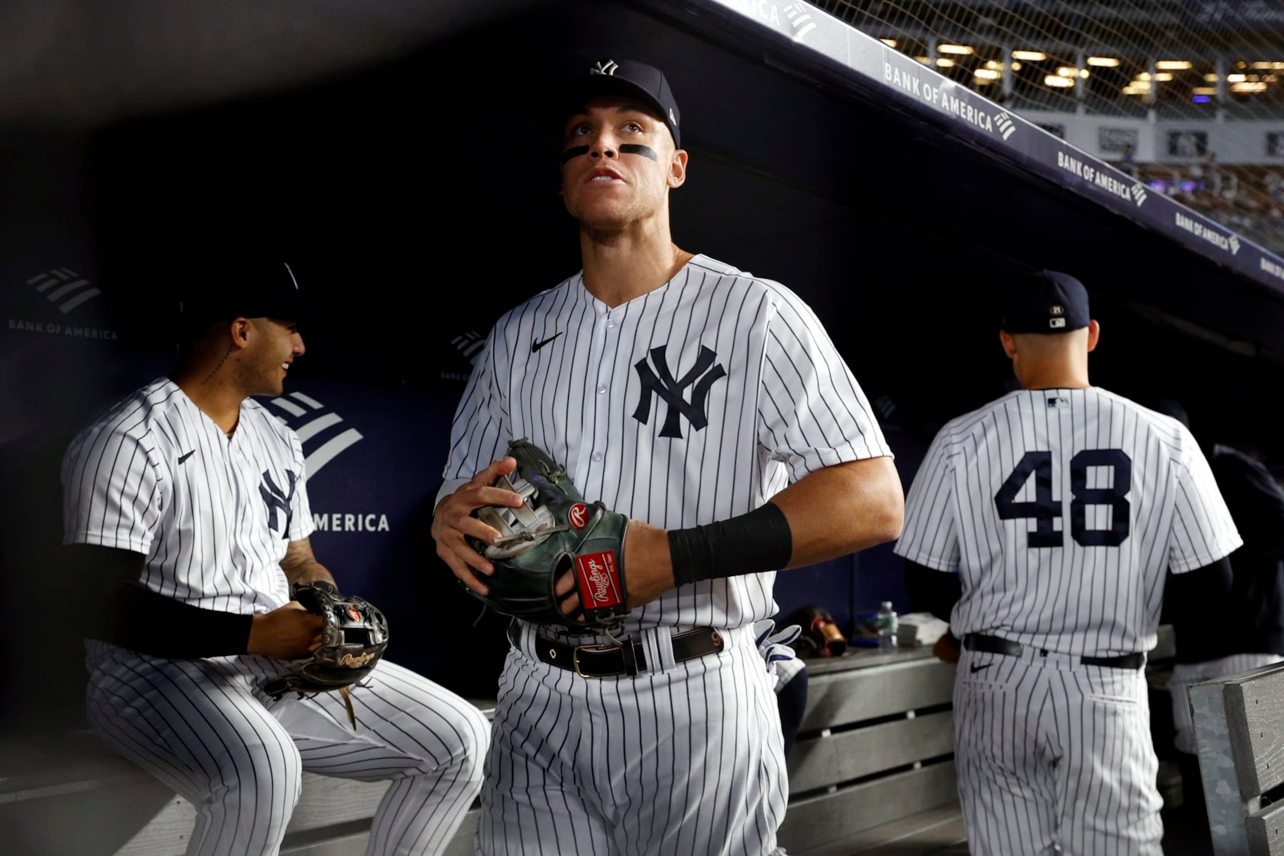 NEW YORK, NEW YORK - SEPTEMBER 22: Aaron Judge #99 of the New York Yankees looks on in the dugout before the first inning against the Boston Red Sox at Yankee Stadium on September 22, 2022 in the Bronx borough of New York City. (Photo by Sarah Stier/Getty Images)