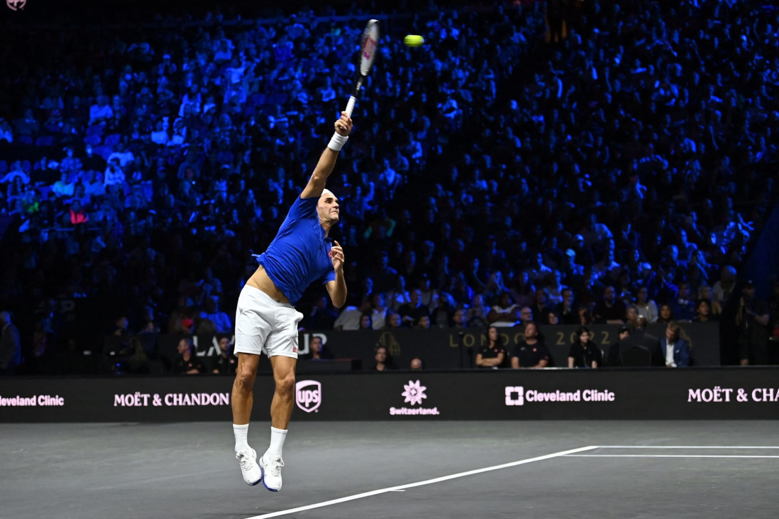 Switzerland's Roger Federer playing with Spain's Rafael Nadal of Team Europe serves against USA's Jack Sock and USA's Frances Tiafoe of Team World during their 2022 Laver Cup men's doubles tennis match at the O2 Arena in London, early on September 24, 2022. - Roger Federer brings the curtain down on his spectacular career in a "super special" match alongside long-time rival Rafael Nadal at the Laver Cup in London on Friday. - RESTRICTED TO EDITORIAL USE (Photo by Glyn KIRK / AFP) / RESTRICTED TO EDITORIAL USE (Photo by GLYN KIRK/AFP via Getty Images) Switzerland's Roger Federer playing with Spain's Rafael Nadal of Team Europe serves against USA's Jack Sock and USA's Frances Tiafoe of Team World during their 2022 Laver Cup men's doubles tennis match at the O2 Arena in London, early on September 24, 2022. - Roger Federer brings the curtain down on his spectacular career in a "super special" match alongside long-time rival Rafael Nadal at the Laver Cup in London on Friday. - RESTRICTED TO EDITORIAL USE (Photo by Glyn KIRK / AFP) / RESTRICTED TO EDITORIAL USE (Photo by GLYN KIRK/AFP via Getty Images)