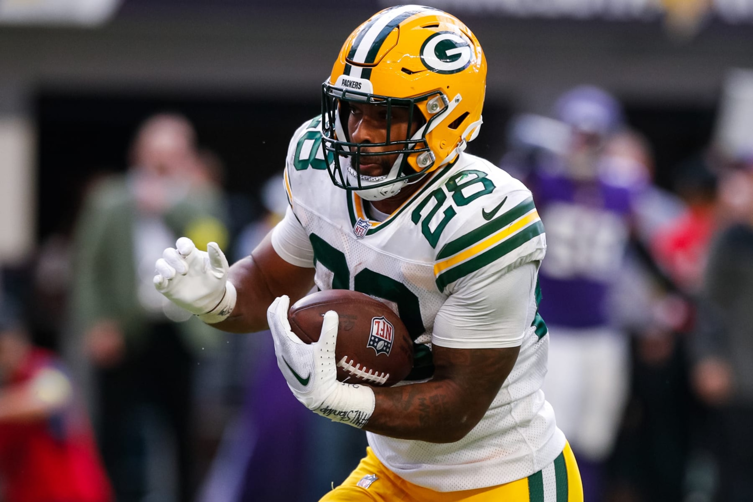 MINNEAPOLIS, MN - SEPTEMBER 11: AJ Dillon #28 of the Green Bay Packers runs with the ball against the Minnesota Vikings in the third quarter of the game at U.S. Bank Stadium on September 11, 2022 in Minneapolis, Minnesota. The Vikings defeated the Packers 23-7. (Photo by David Berding/Getty Images)