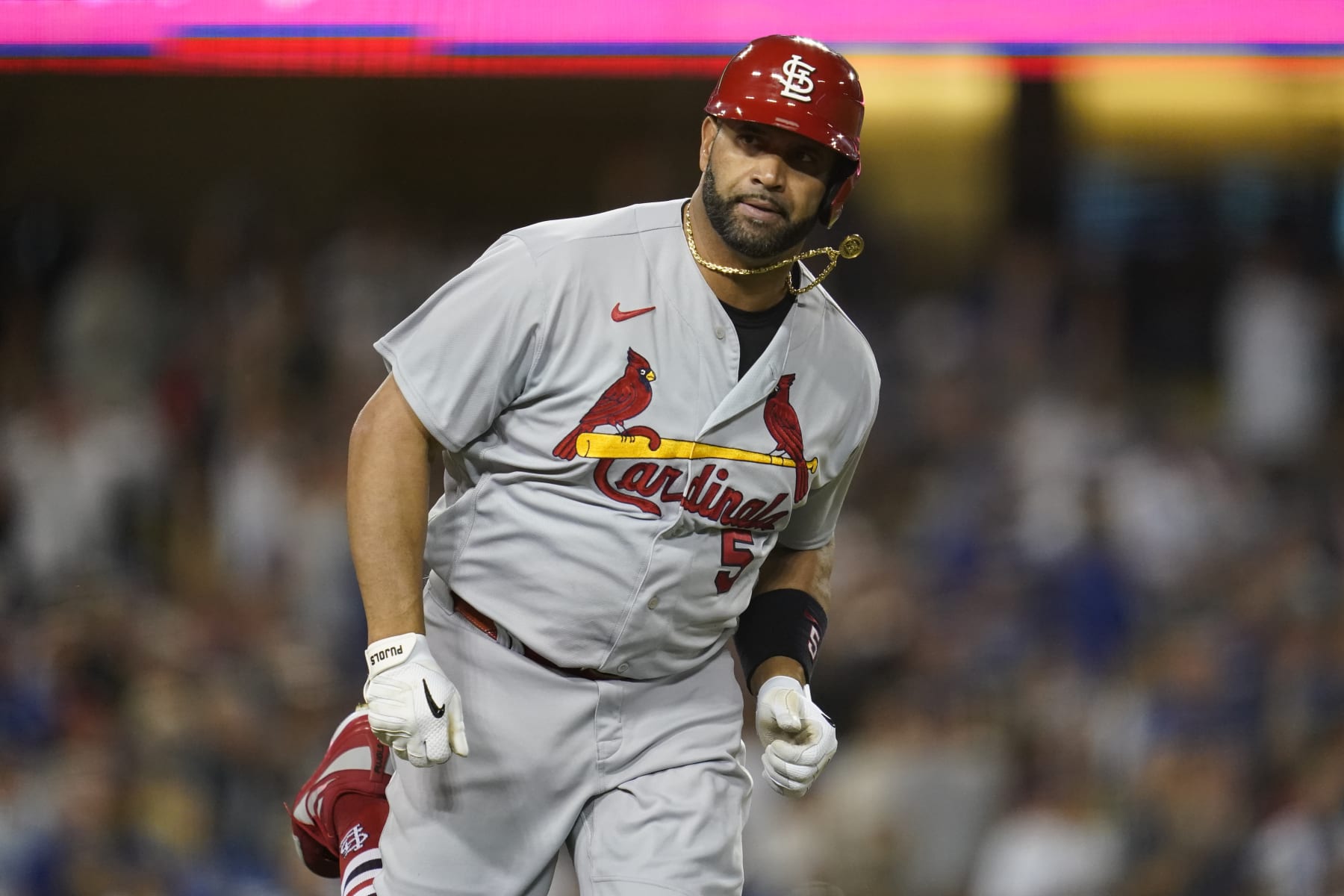 CORRECTS TO ST. LOUIS CARDINALS' ALBERT PUJOLS, INSTEAD OF LOS ANGELES DODGERS' FREDDIE FREEMAN - St. Louis Cardinals' Albert Pujols runs the bases after hitting a two-run home run during the third inning of a baseball game against the Los Angeles Dodgers in Los Angeles, Friday, Sept. 23, 2022. (AP Photo/Ashley Landis)