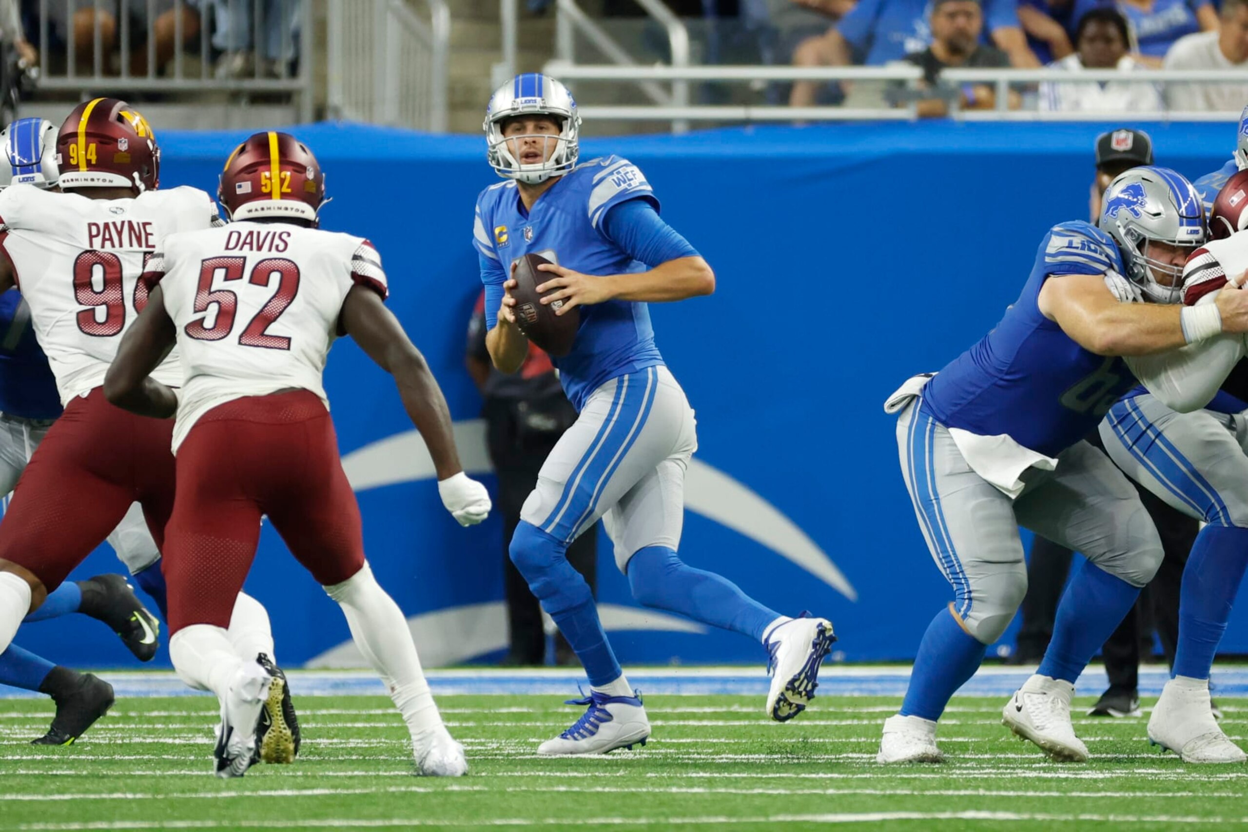 Detroit Lions quarterback Jared Goff (16) drops back to pass against the Washington Commanders during an NFL football game, Sunday, Sept. 18, 2022, in Detroit. (AP Photo/Rick Osentoski)