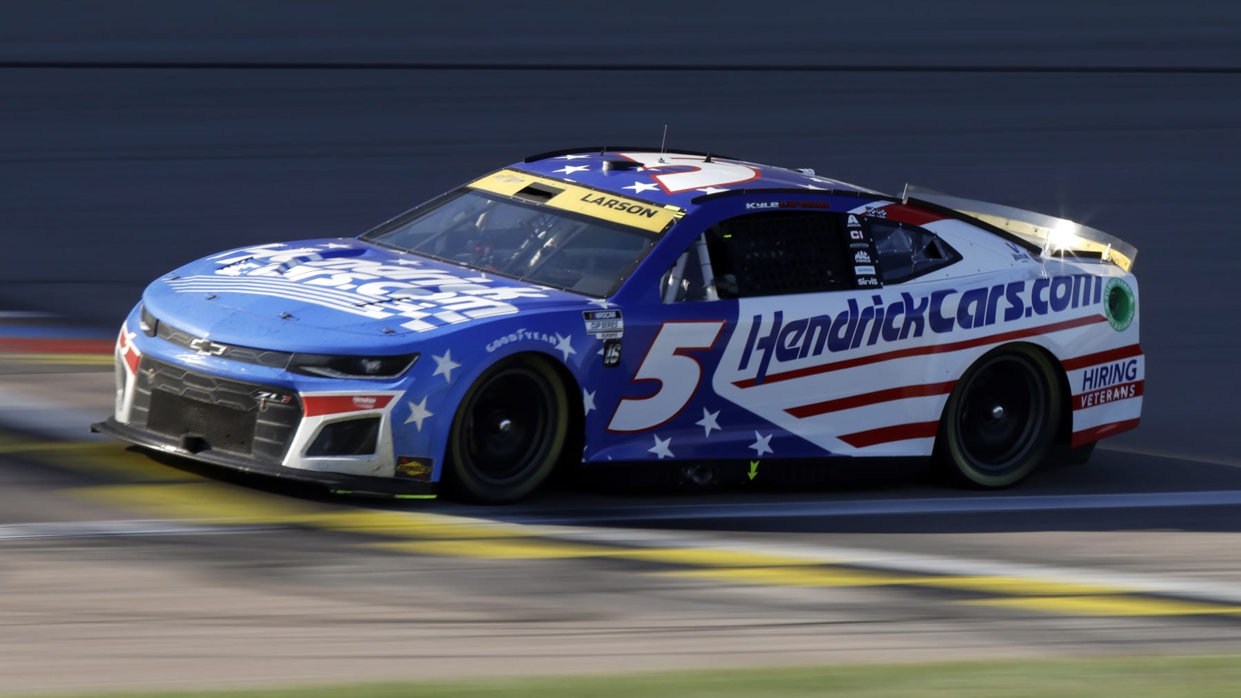 Kyle Larson drives the No. 5 car down the front straightaway during a NASCAR Cup Series auto race at Kansas Speedway in Kansas City, Kan., Sunday, Sept. 11, 2022. (AP Photo/Colin E. Braley)