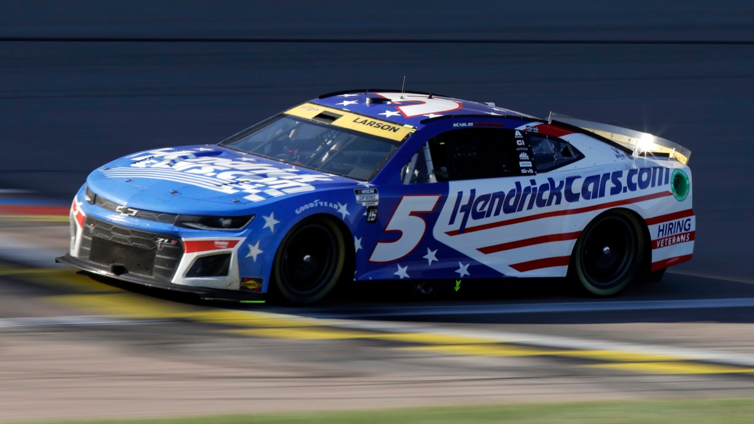 Kyle Larson drives the No. 5 car down the front straightaway during a NASCAR Cup Series auto race at Kansas Speedway in Kansas City, Kan., Sunday, Sept. 11, 2022. (AP Photo/Colin E. Braley)