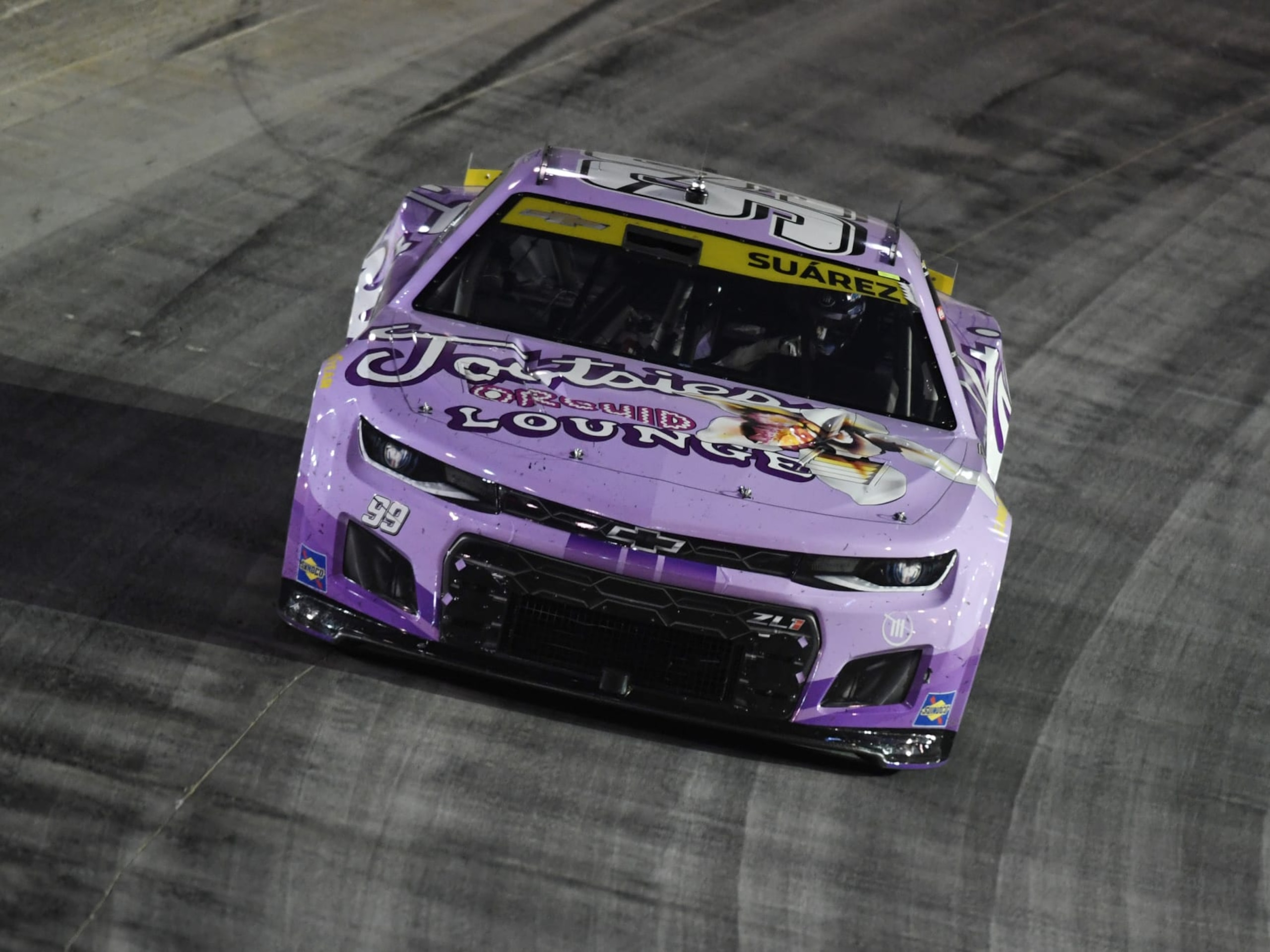 BRISTOL, TN - SEPTEMBER 17: Daniel Suarez (#99 TrackHouse Racing Tootsies Orchid Lounge Chevrolet) races through Turn 4 during the NASCAR Cup Series Playoff Bass Pro Shops Night Race on September 17, 2022, at Bristol Motor Speedway in Bristol, TN. (Photo by Jeffrey Vest/Icon Sportswire via Getty Images)
