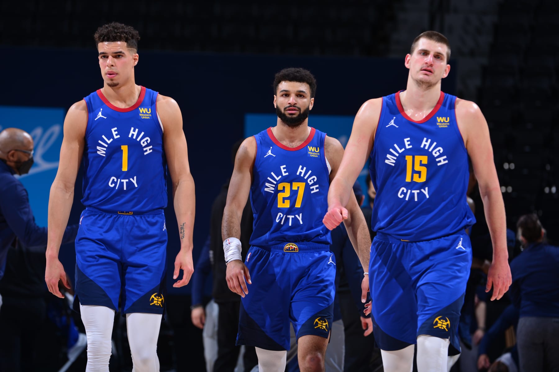 DENVER, CO - FEBRUARY 12: Michael Porter Jr. #1, Jamal Murray #27, and Nikola Jokic #15 of the Denver Nuggets look on during the game against the Oklahoma City Thunder on February 12, 2021 at the Ball Arena in Denver, Colorado. NOTE TO USER: User expressly acknowledges and agrees that, by downloading and/or using this Photograph, user is consenting to the terms and conditions of the Getty Images License Agreement. Mandatory Copyright Notice: Copyright 2021 NBAE (Photo by Bart Young/NBAE via Getty Images)