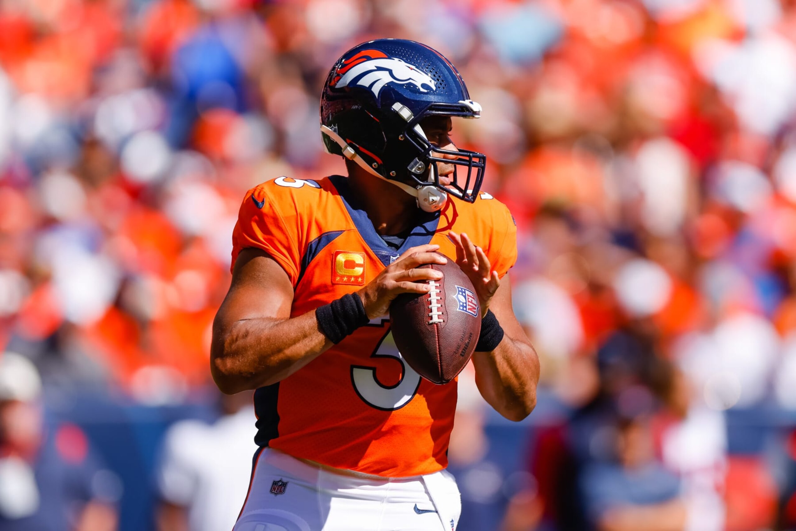 DENVER, CO - SEPTEMBER 18:  Quarterback Russell Wilson #3 of the Denver Broncos drops back to pass during the first quarter against the Houston Texans at Empower Field at Mile High on September 18, 2022 in Denver, Colorado. (Photo by Justin Edmonds/Getty Images)