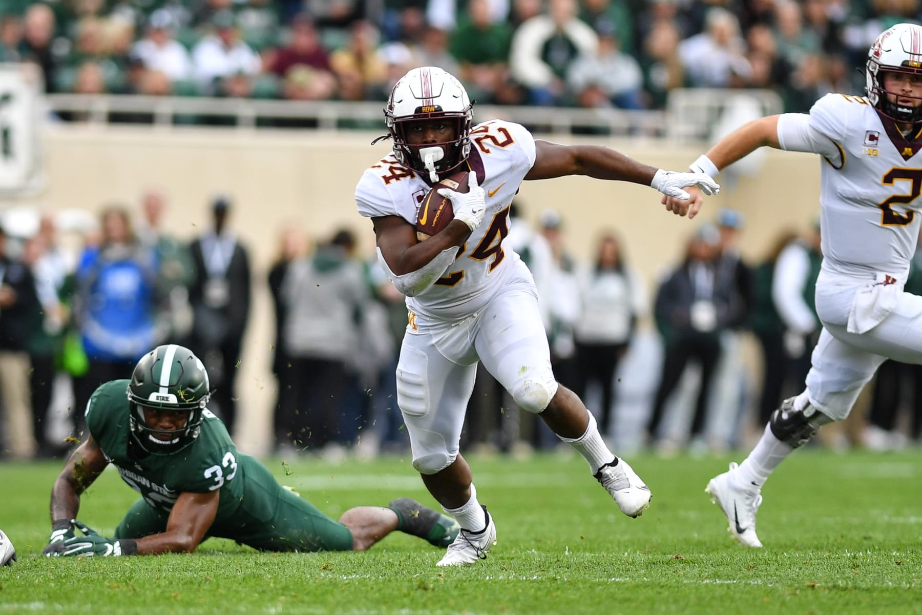 EAST LANSING, MI - SEPTEMBER 24: Minnesota Golden Gophers running back Mohamed Ibrahim (24) runs through a gaping hole during a college football game between the Michigan State Spartans and Minnesota Golden Gophers on September 24, 2022 at Spartan Stadium in East Lansing, MI (Photo by Adam Ruff/Icon Sportswire via Getty Images)(