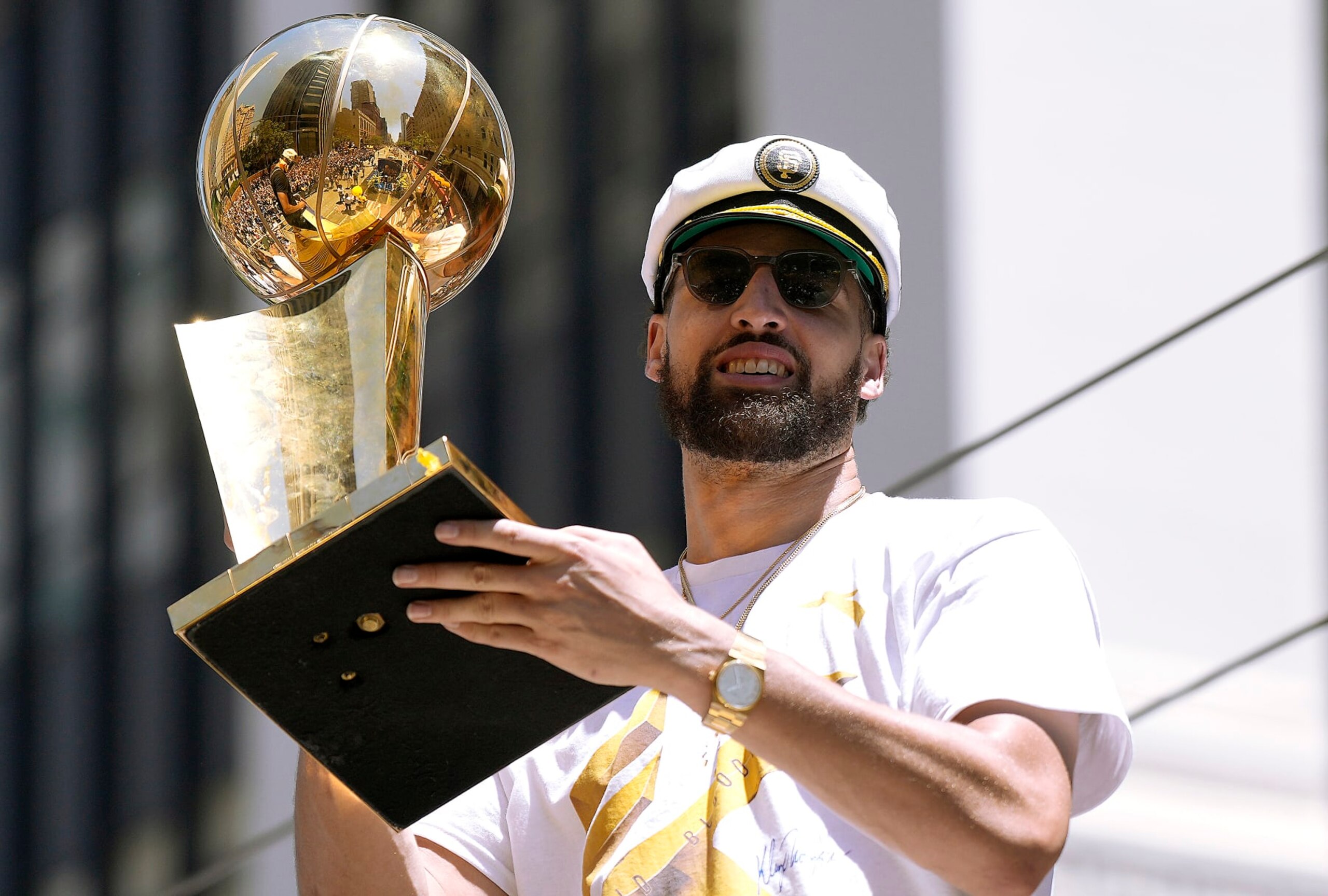 SAN FRANCISCO, CALIFORNIA - JUNE 20: Klay Thompson #11 of the Golden State Warriors celebrates with the NBA Championship Trophy during the Golden State Warriors Victory Parade on June 20, 2022 in San Francisco, California. The Golden State Warriors beat the Boston Celtics 4-2 to win the 2022 NBA Finals. NOTE TO USER: User expressly acknowledges and agrees that, by downloading and or using this photograph, User is consenting to the terms and conditions of the Getty Images License Agreement. (Photo by Thearon W. Henderson/Getty Images)(Photo by Thearon W. Henderson/Getty Images)
