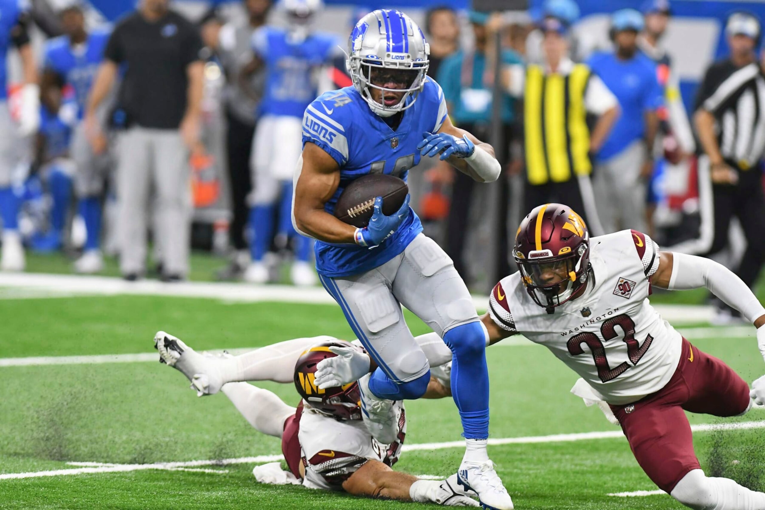 Detroit Lions wide receiver Amon-Ra St. Brown (14) runs after making a catch during the first half of an NFL football game against the Washington Commanders Sunday, Sept. 18, 2022, in Detroit. (AP Photo/Lon Horwedel) Detroit Lions wide receiver Amon-Ra St. Brown (14) runs after making a catch during the first half of an NFL football game against the Washington Commanders Sunday, Sept. 18, 2022, in Detroit. (AP Photo/Lon Horwedel)