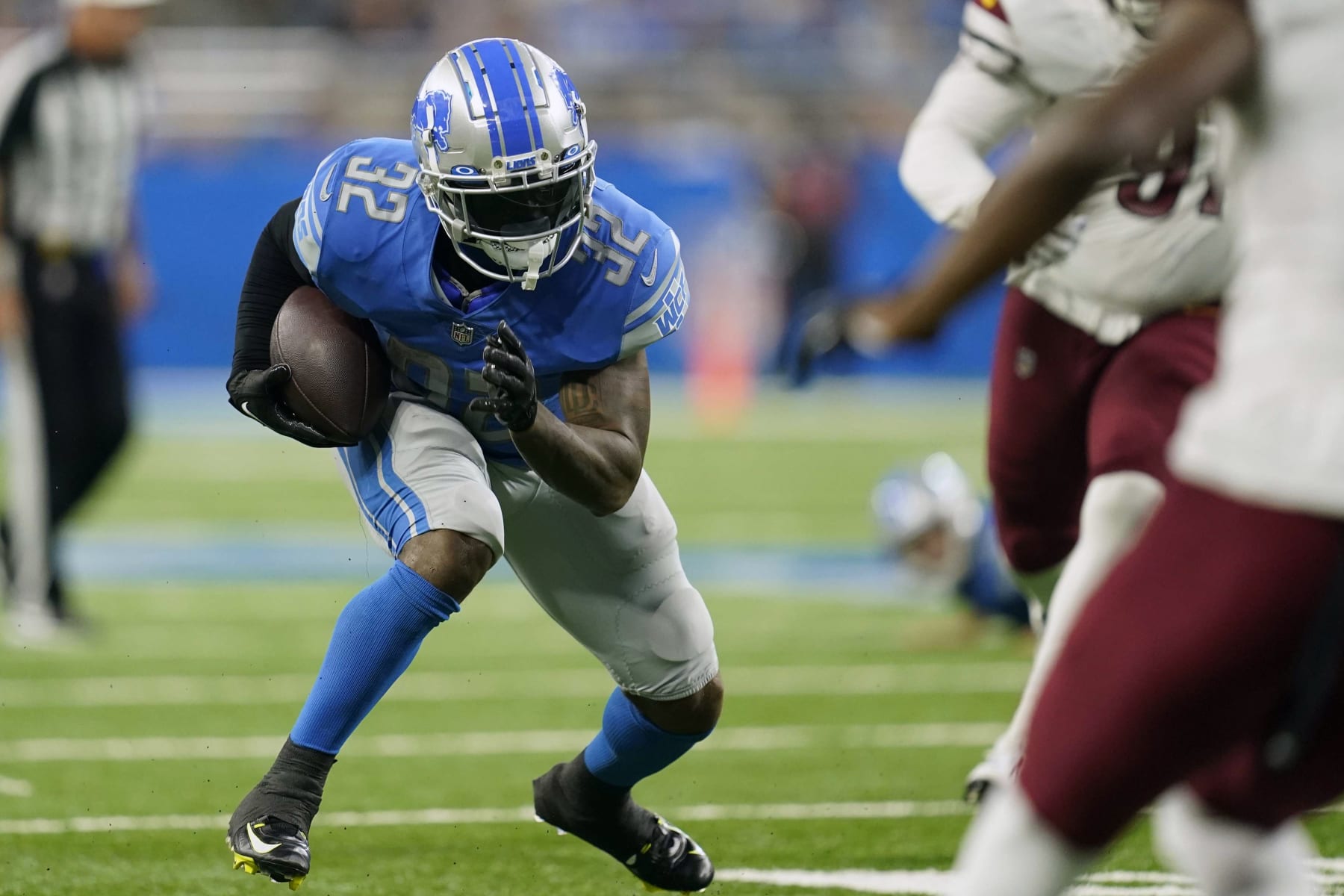 Detroit Lions running back D'Andre Swift (32) makes a touchdown run during the second half of an NFL football game against the Washington Commanders Sunday, Sept. 18, 2022, in Detroit. (AP Photo/Paul Sancya)