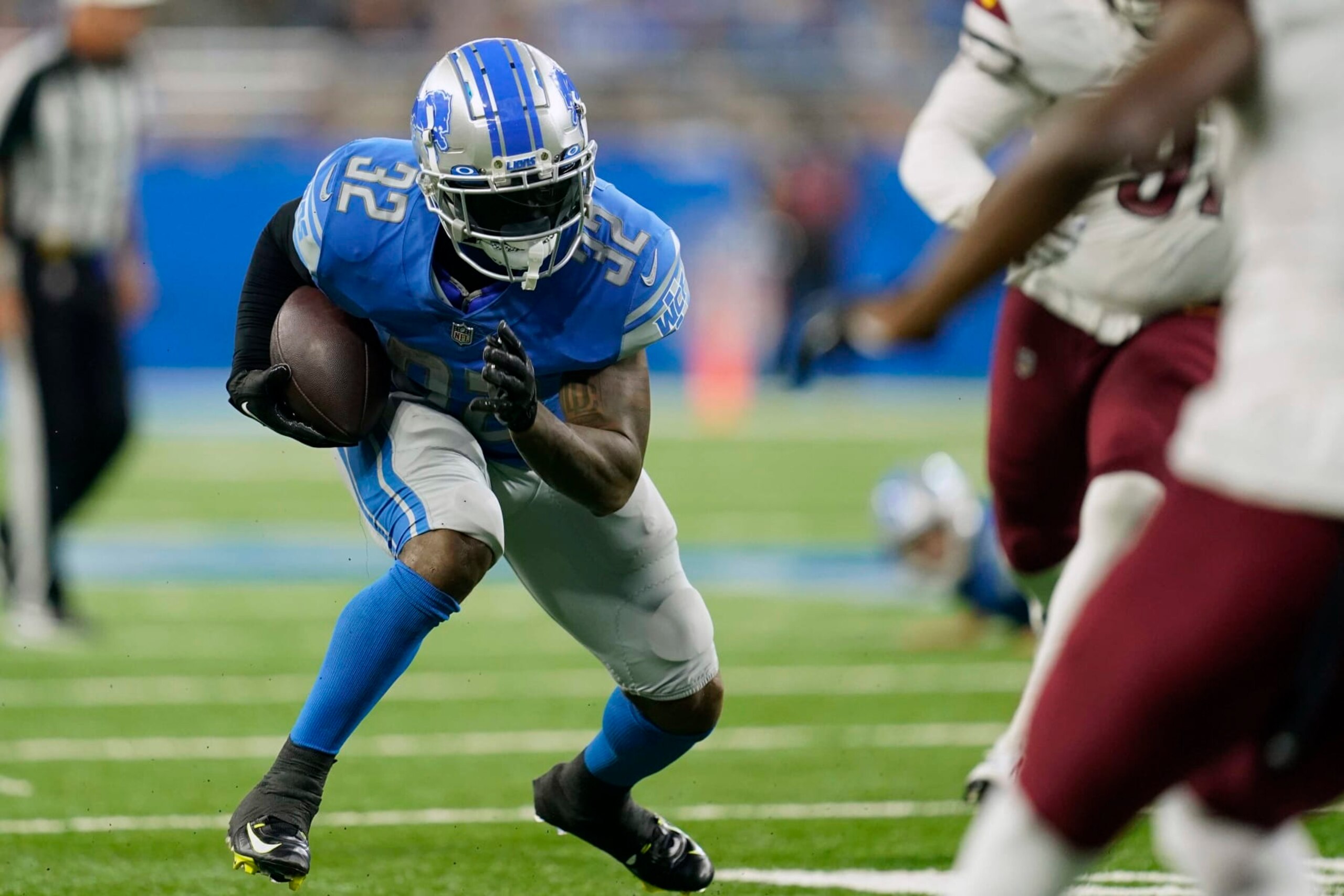 Detroit Lions running back D'Andre Swift (32) makes a touchdown run during the second half of an NFL football game against the Washington Commanders Sunday, Sept. 18, 2022, in Detroit. (AP Photo/Paul Sancya) Detroit Lions running back D'Andre Swift (32) makes a touchdown run during the second half of an NFL football game against the Washington Commanders Sunday, Sept. 18, 2022, in Detroit. (AP Photo/Paul Sancya)