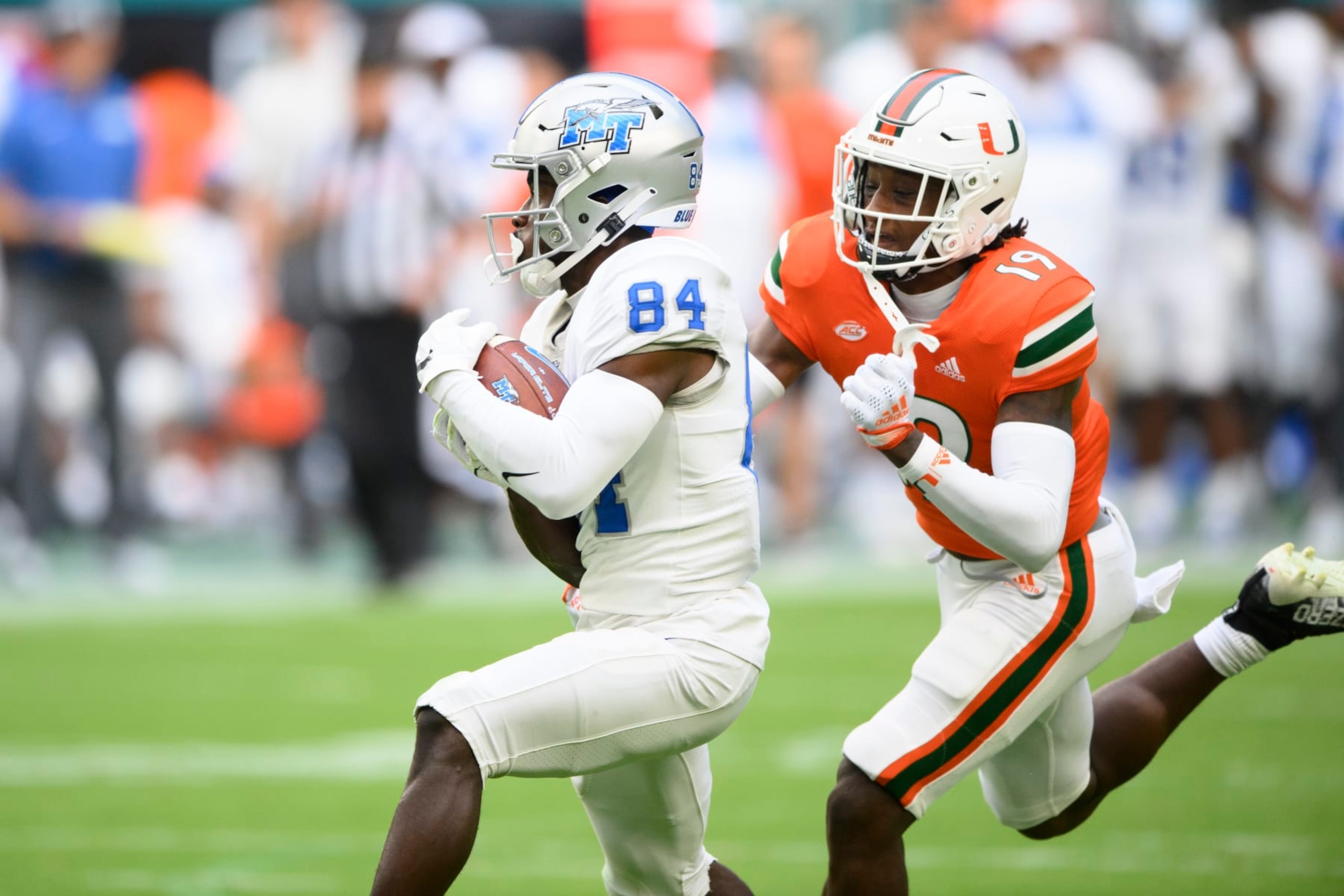 Middle Tennessee wide receiver Elijah Metcalf (84) catches the ball and out runs Miami defensive back Jaden Harris (19) to score a touchdown during an NCAA football game on Saturday, Sept. 24, 2022 in Miami Gardens. (AP Photo/Doug Murray) Middle Tennessee wide receiver Elijah Metcalf (84) catches the ball and out runs Miami defensive back Jaden Harris (19) to score a touchdown during an NCAA football game on Saturday, Sept. 24, 2022 in Miami Gardens. (AP Photo/Doug Murray)