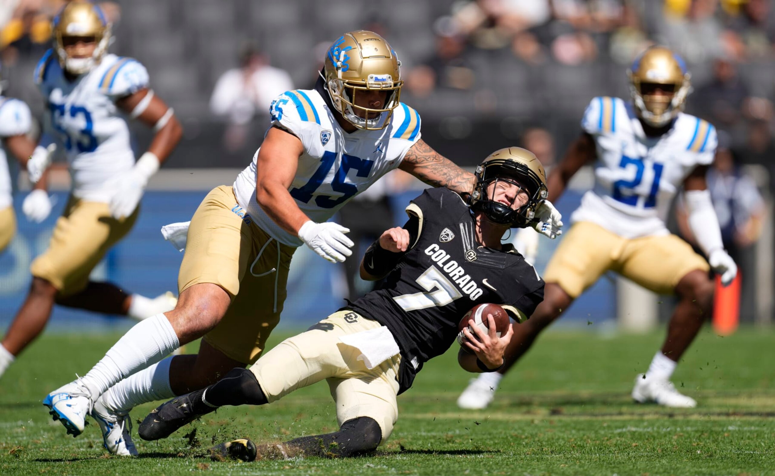 UCLA linebacker Laiatu Latu, left, sacks Colorado quarterback Owen McCown in the first half of an NCAA college football game Saturday, Sept. 24, 2022, in Boulder, Colo. (AP Photo/David Zalubowski) UCLA linebacker Laiatu Latu, left, sacks Colorado quarterback Owen McCown in the first half of an NCAA college football game Saturday, Sept. 24, 2022, in Boulder, Colo. (AP Photo/David Zalubowski)