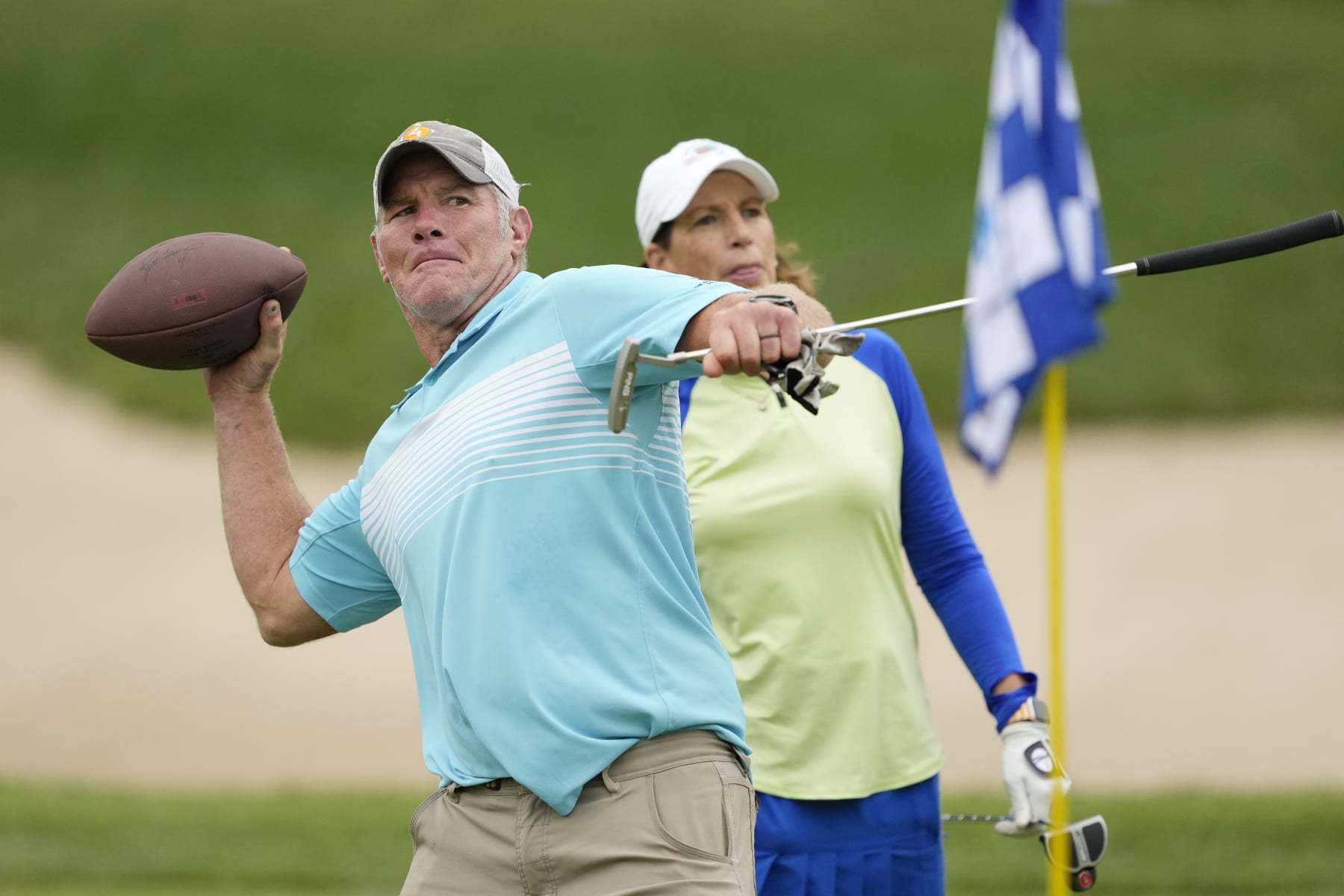 MADISON, WISCONSIN - JUNE 11: Former NFL player Brett Favre throws a football to a fan on the 14th green during the Celebrity Foursome at the second round of the American Family Insurance Championship at University Ridge Golf Club on June 11, 2022 in Madison, Wisconsin. (Photo by Patrick McDermott/Getty Images) MADISON, WISCONSIN - JUNE 11: Former NFL player Brett Favre throws a football to a fan on the 14th green during the Celebrity Foursome at the second round of the American Family Insurance Championship at University Ridge Golf Club on June 11, 2022 in Madison, Wisconsin. (Photo by Patrick McDermott/Getty Images)