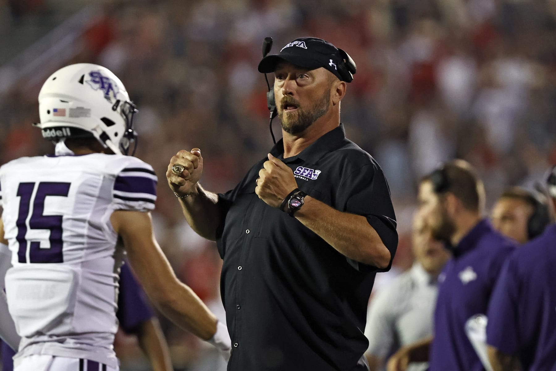 Stephen F. Austin coach Colby Carthel yells after a touchdown during the second half of the team's NCAA college football game against Texas Tech, Saturday, Sept. 11, 2021, in Lubbock, Texas. (AP Photo/Brad Tollefson)