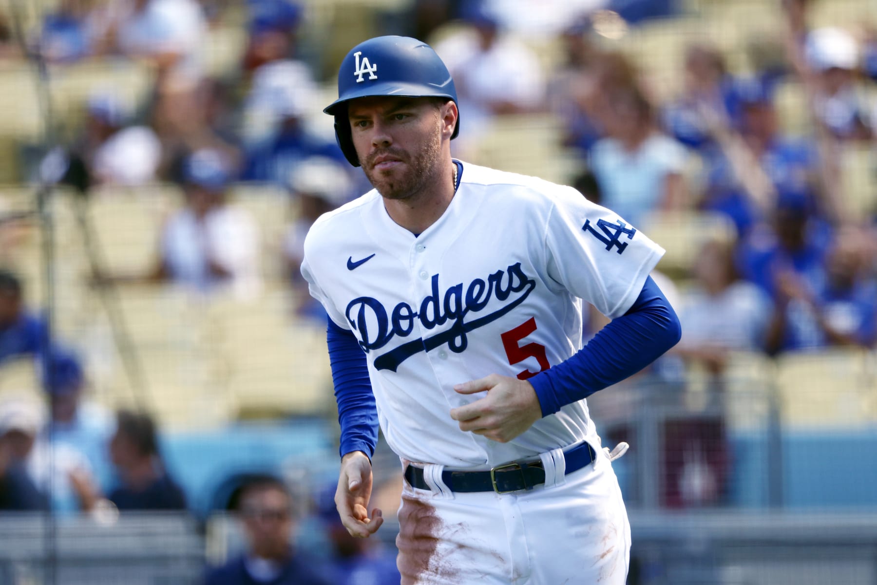 LOS ANGELES, CALIFORNIA - SEPTEMBER 20: Freddie Freeman #5 of the Los Angeles Dodgers runs to the dugout after a sacrifice fly by teammate Trayce Thompson #25 against the Arizona Diamondbacks during the first inning in game one of a doubleheader at Dodger Stadium on September 20, 2022 in Los Angeles, California. (Photo by Katelyn Mulcahy/Getty Images)