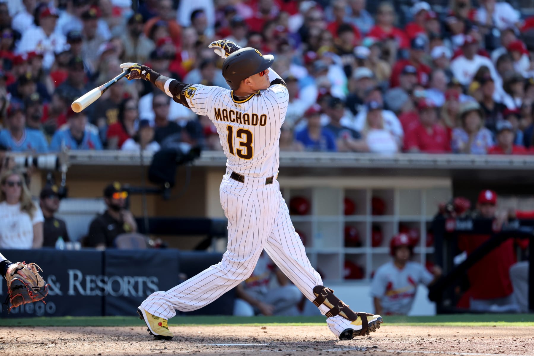 SAN DIEGO, CA - SEPTEMBER 22:  San Diego Padres third baseman Manny Machado (13) hits a homerun in the eighth inning against the St. Louis Cardinals on September 22, 2022, at Petco Park in San Diego, CA. (Photo by Kiyoshi Mio/Icon Sportswire via Getty Images)
