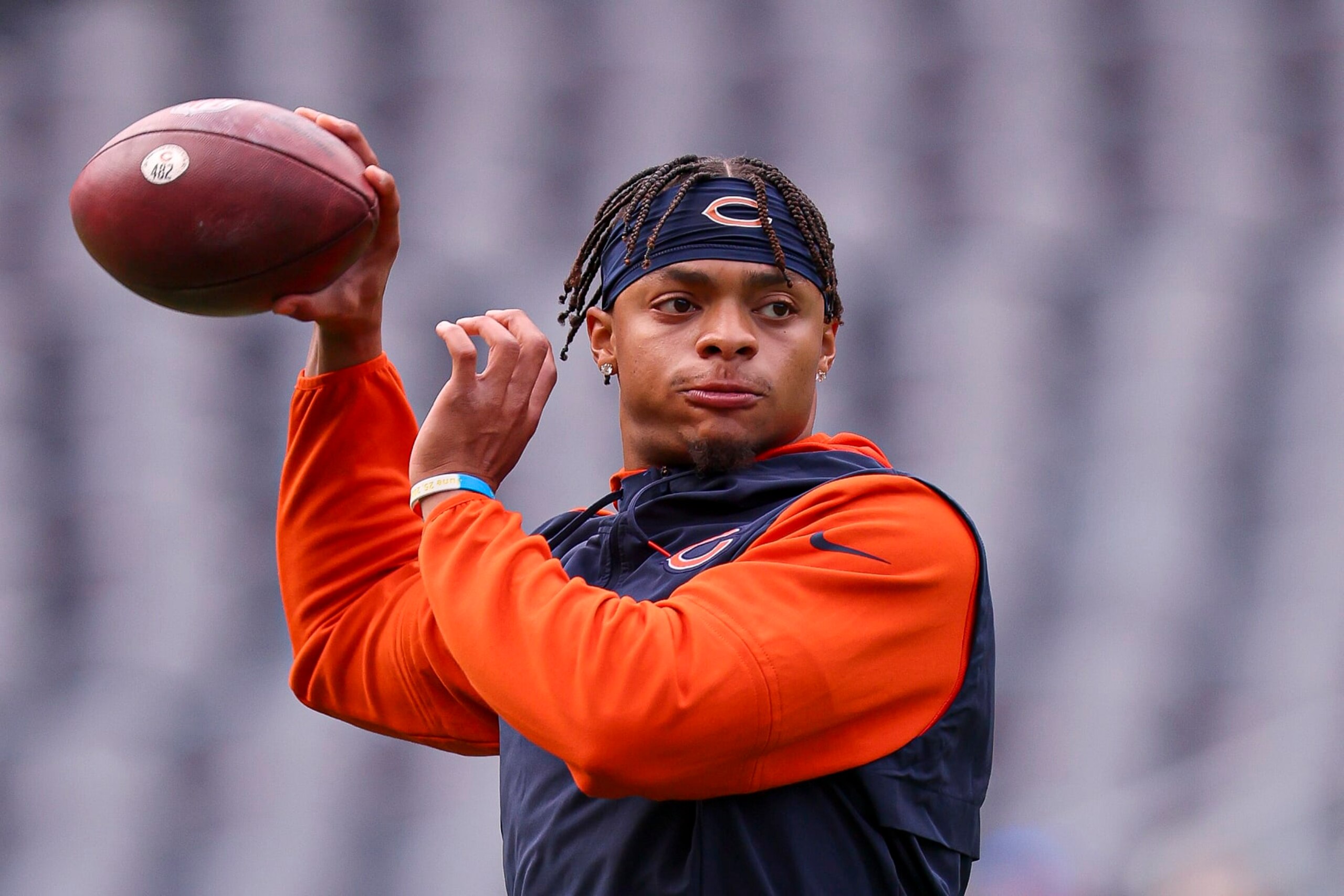CHICAGO, ILLINOIS - SEPTEMBER 25: Quarterback Justin Fields #1 of the Chicago Bears warms up at Soldier Field on September 25, 2022 in Chicago, Illinois. (Photo by Michael Reaves/Getty Images)