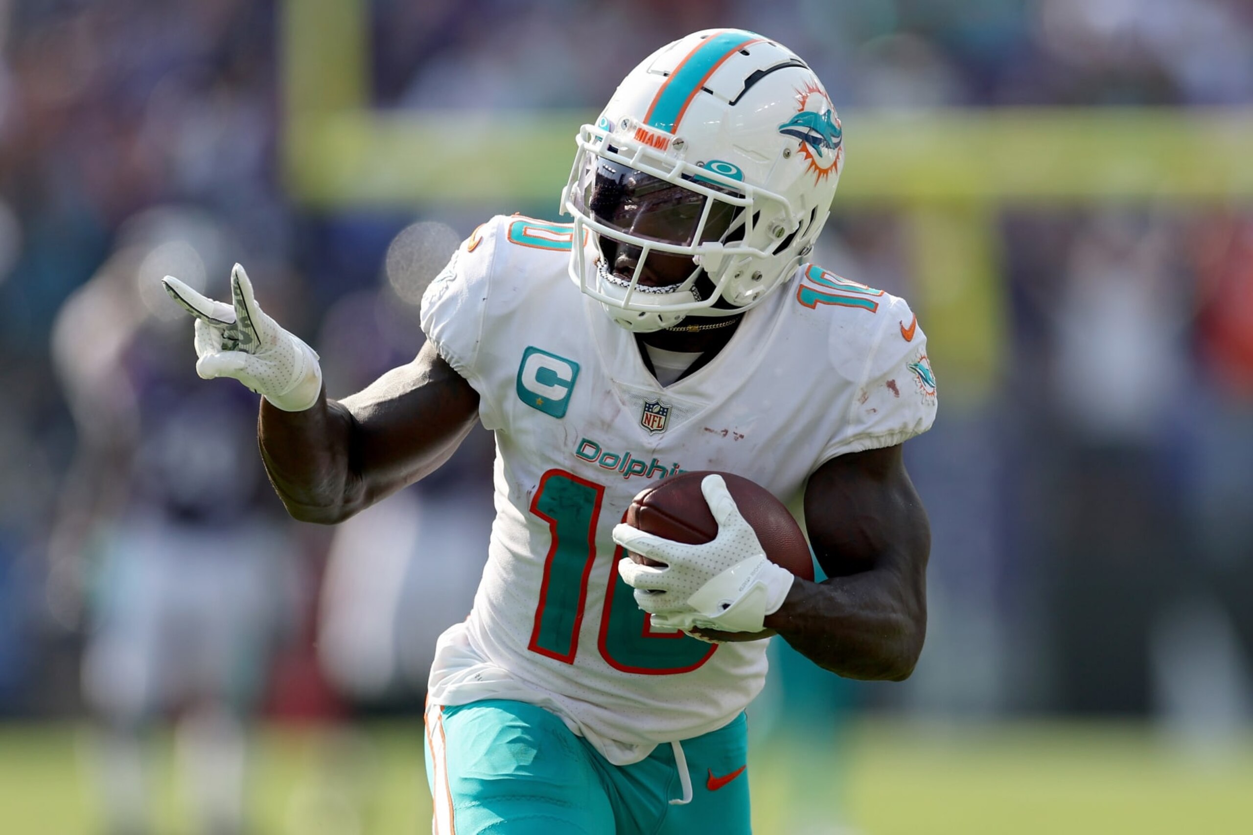 BALTIMORE, MARYLAND - SEPTEMBER 18: Tyreek Hill #10 of the Miami Dolphins celebrates a touchdown catch against the Baltimore Ravens in the fourth quarter at M&T Bank Stadium on September 18, 2022 in Baltimore, Maryland. (Photo by Rob Carr/Getty Images)